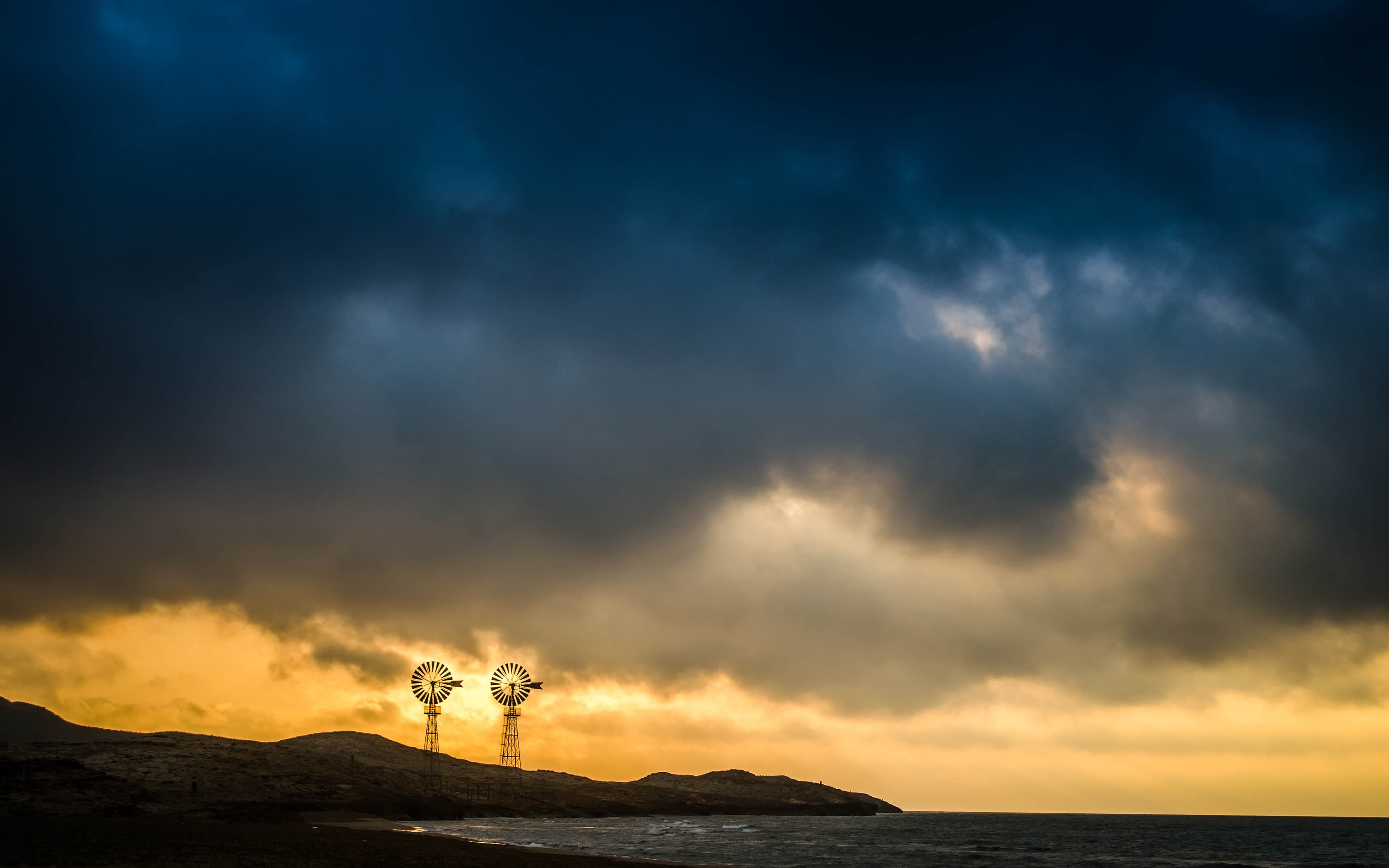 standing, cloud - sky, land, water, coast, leisure activity, scenics - nature, tranquil scene, non-urban scene, windmill, tranquility, horizon over water, HD Wallpaper