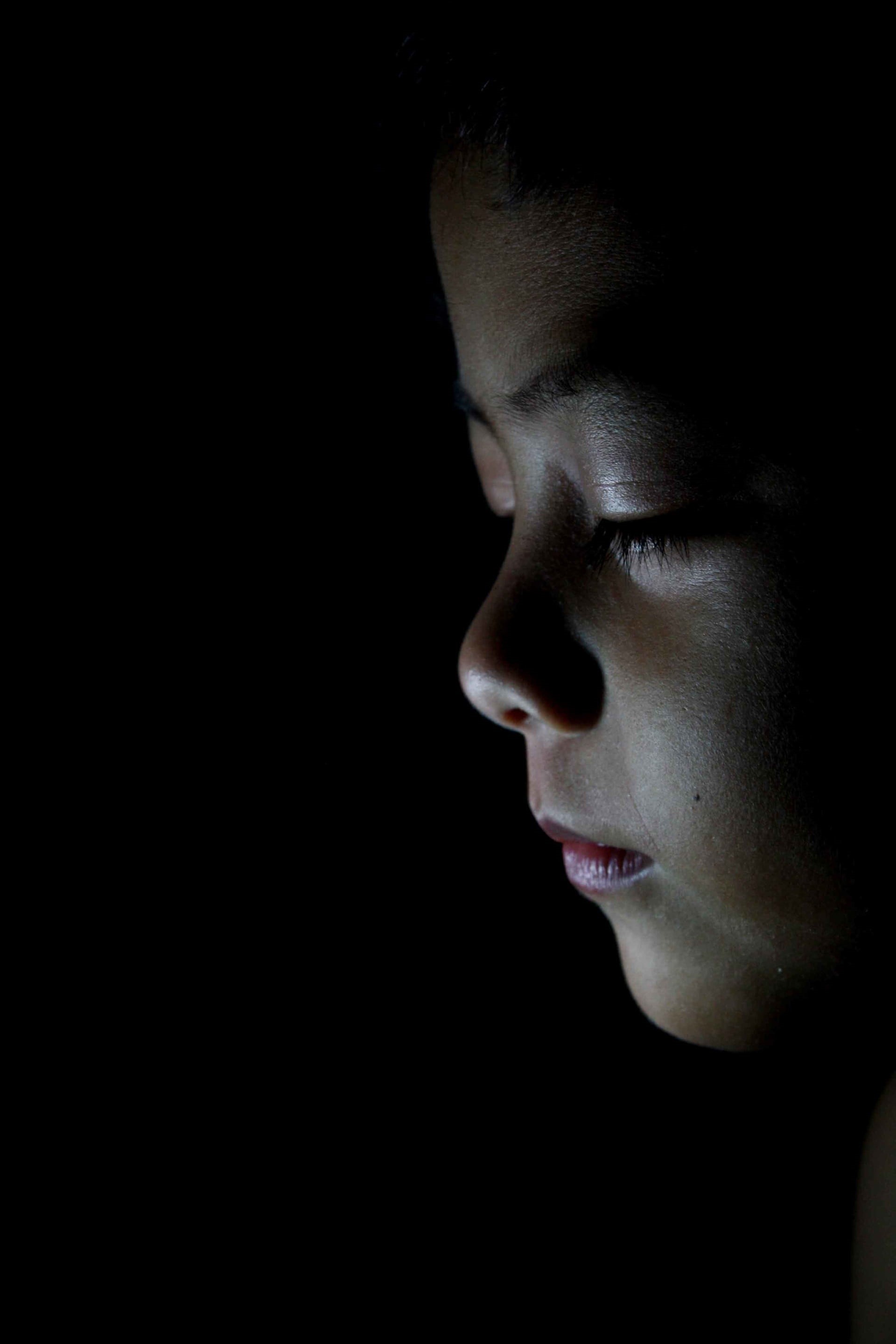 lifestyles, boy, close-up, people, body part, human body part, kid, child, young adult, dark, human face, indoors, 2K, one person, looking away, headshot, Phone HD Wallpaper