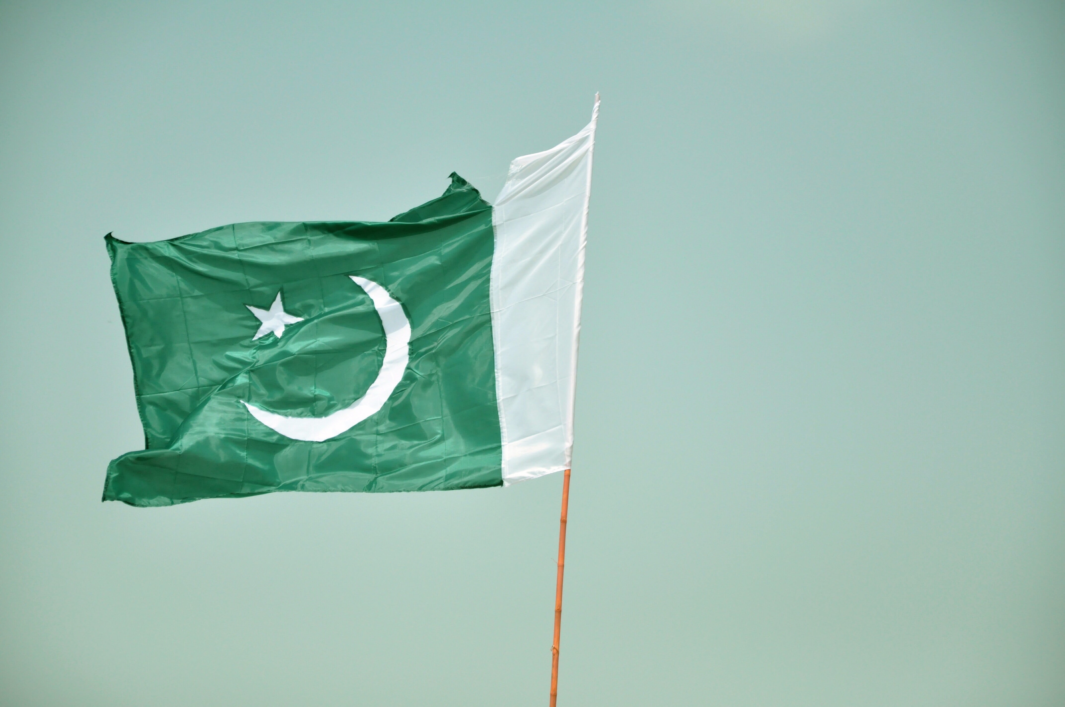 copy space, white, wind, environment, flag, day, nature, sky, green, outdoors, no people, green color, Pakistan, pole, low angle view, 4K, textile, blue, HD Wallpaper