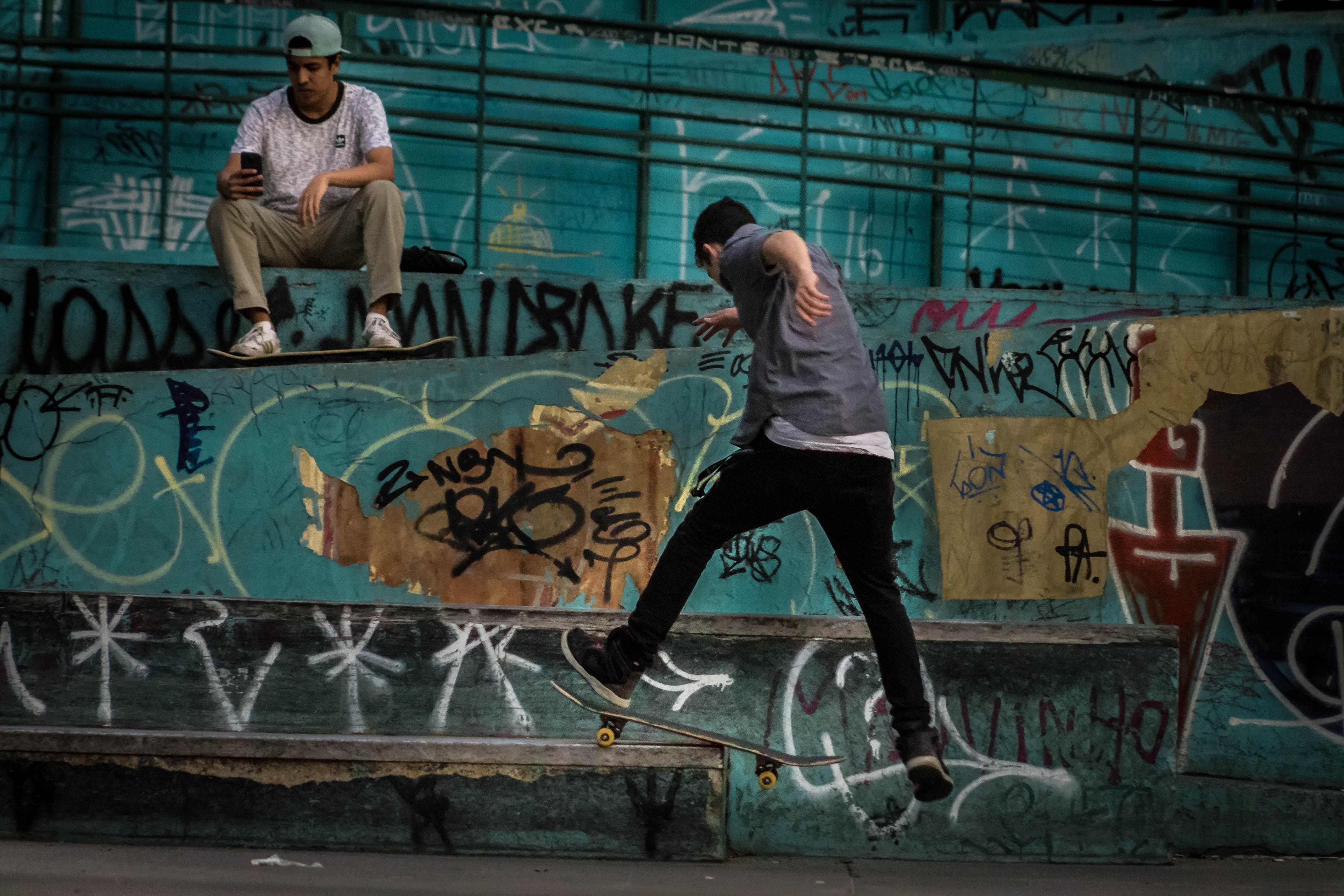 casual clothing, action, fun, skate, skateboard park, shirt, wall, real people, hip hop, jump, leisure activity, skater, tricks, graffiti, sports equipment, HD Wallpaper