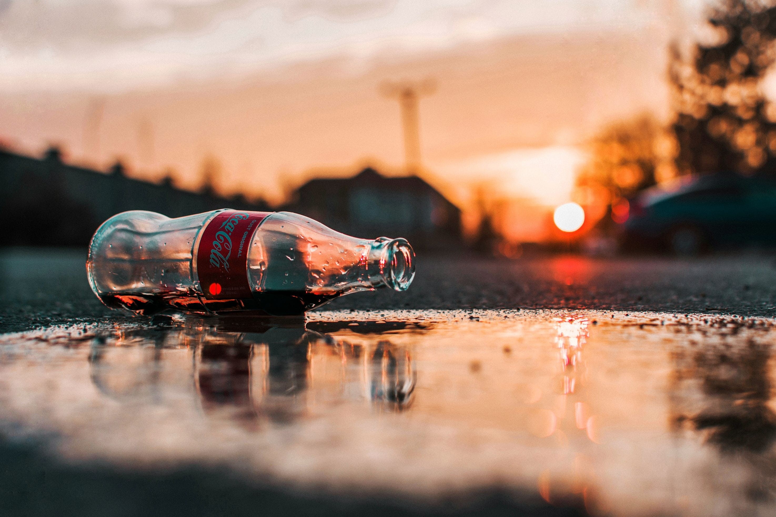 surface level, refreshment, orange, grey, sunrise, pavement, car, no people, coca, bottle, sun, environment, red, focus on foreground, reflection, cola, HD Wallpaper