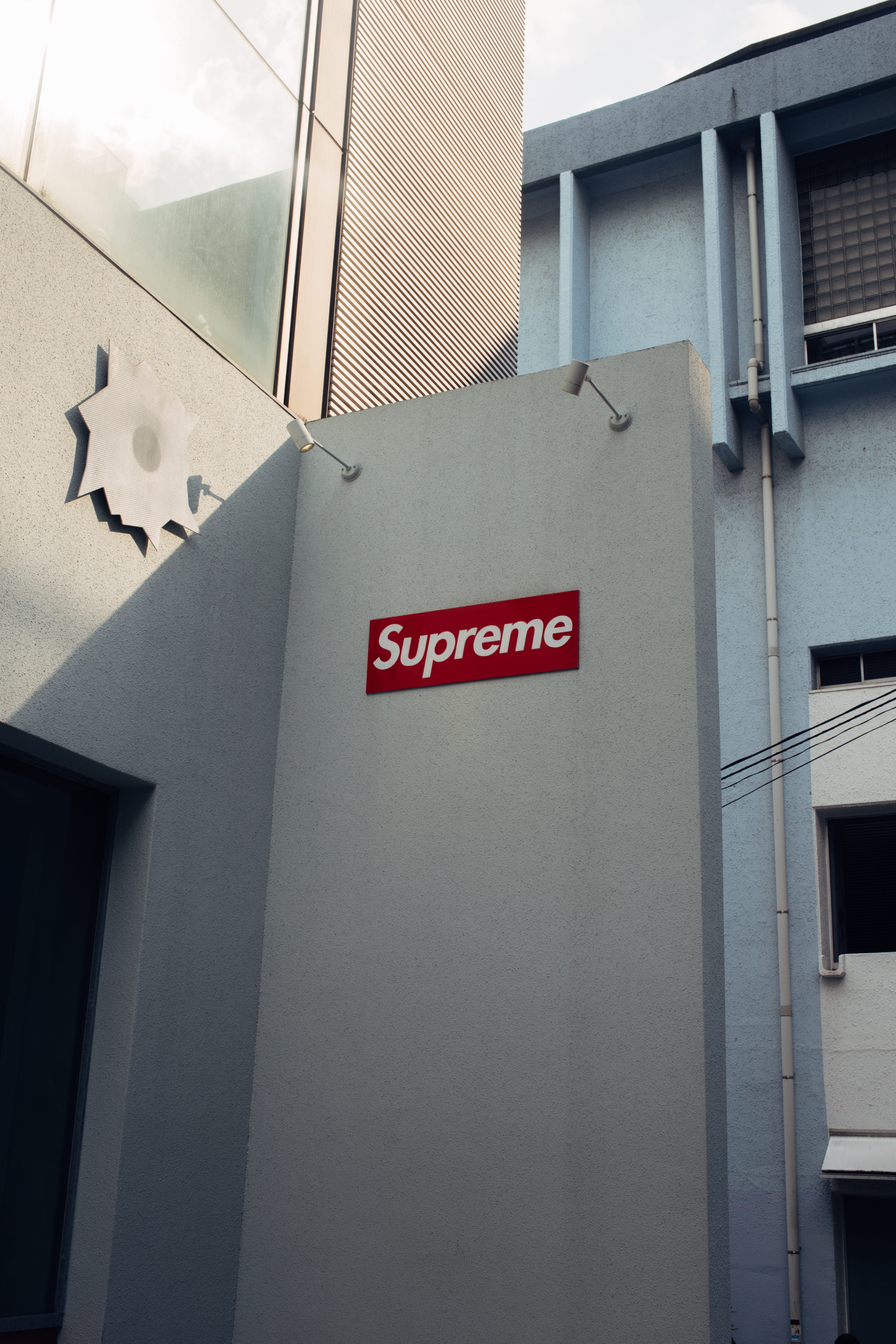 railing, office building, building exterior, wall, capital letter, supreme, logo, information sign, banister, direction, alphabet, 5K, no people, window, Phone HD Wallpaper