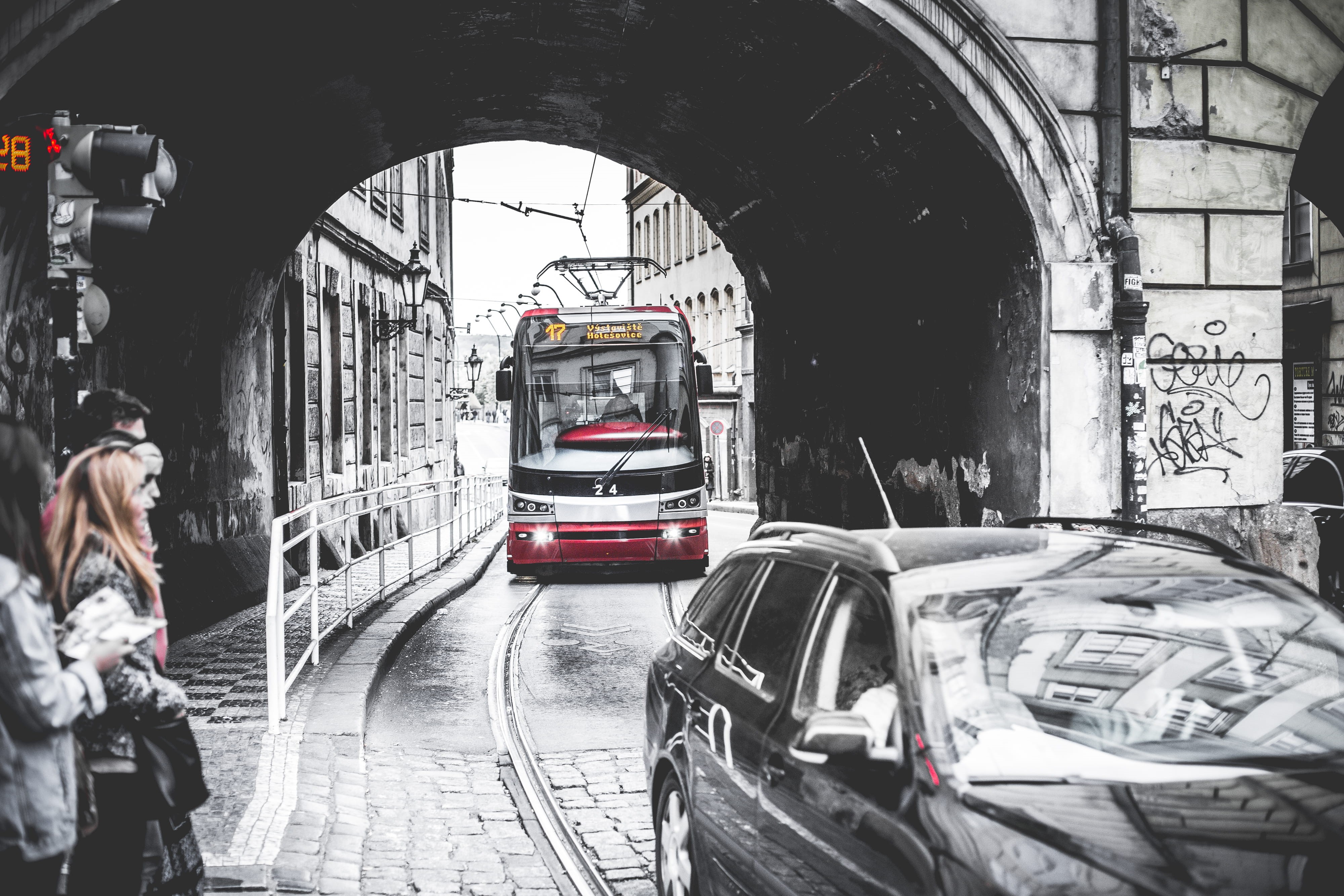 black and white, city, architecture, street, incidental people, arch, train - vehicle, Tram, urban Scene, commuter, land vehicle, building exterior, rail transportation, HD Wallpaper