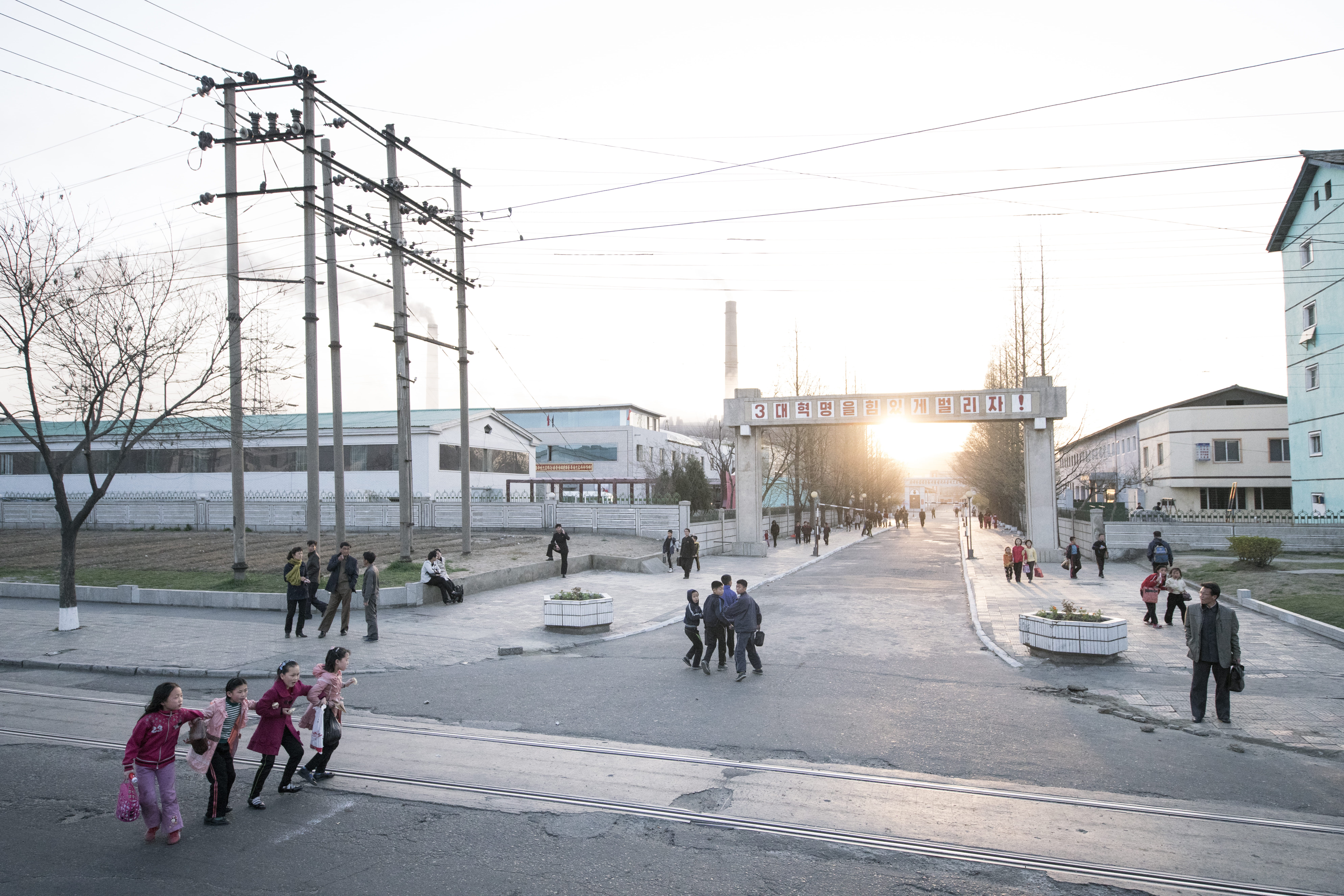 architecture, people, electricity, road, near, street scene, transportation, sky, pyongyang, tarmac, path, land vehicle, standing, human, streets, outdoors, HD Wallpaper