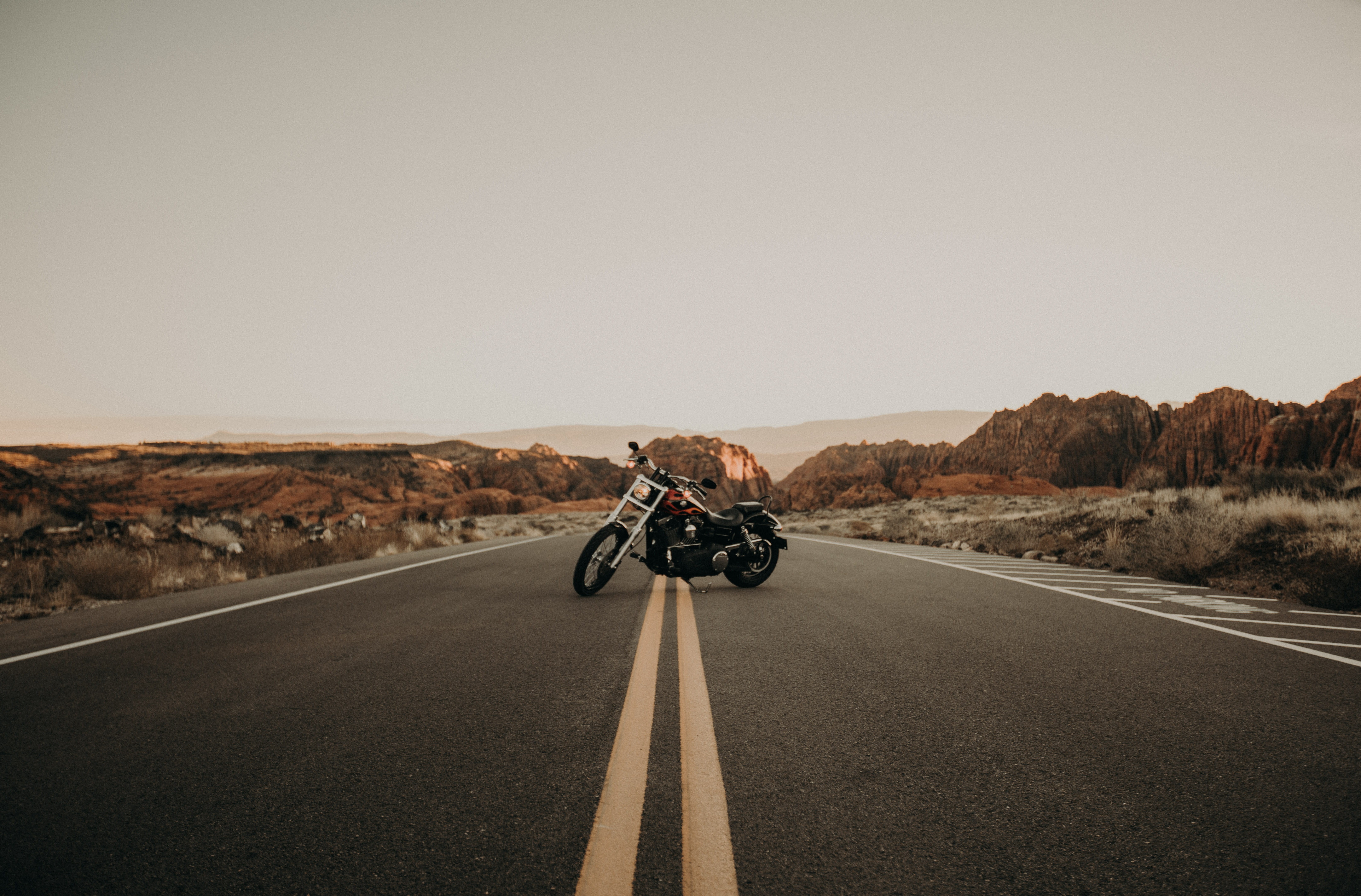 biker, the way forward, town, transportation, road, symbol, tarmac, machine, real people, highway, cruiser, one person, horizon, sky, ride, black, sign, HD Wallpaper