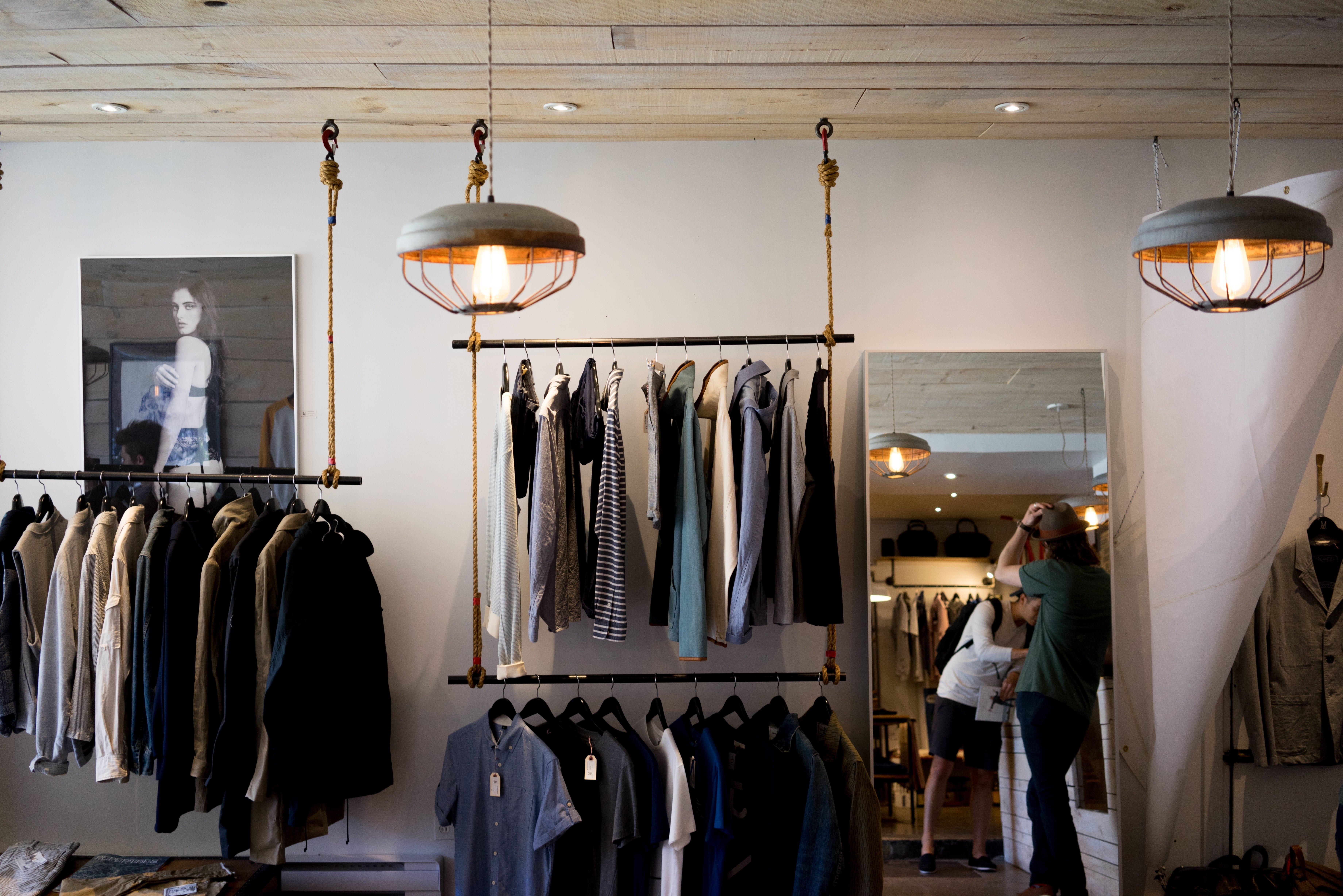 boutique, wardrobe, electric lamp, lot, commerce, real people, clothing, women, lighting equipment, clothing store, 5K, shopping, casual clothing, hanging, HD Wallpaper