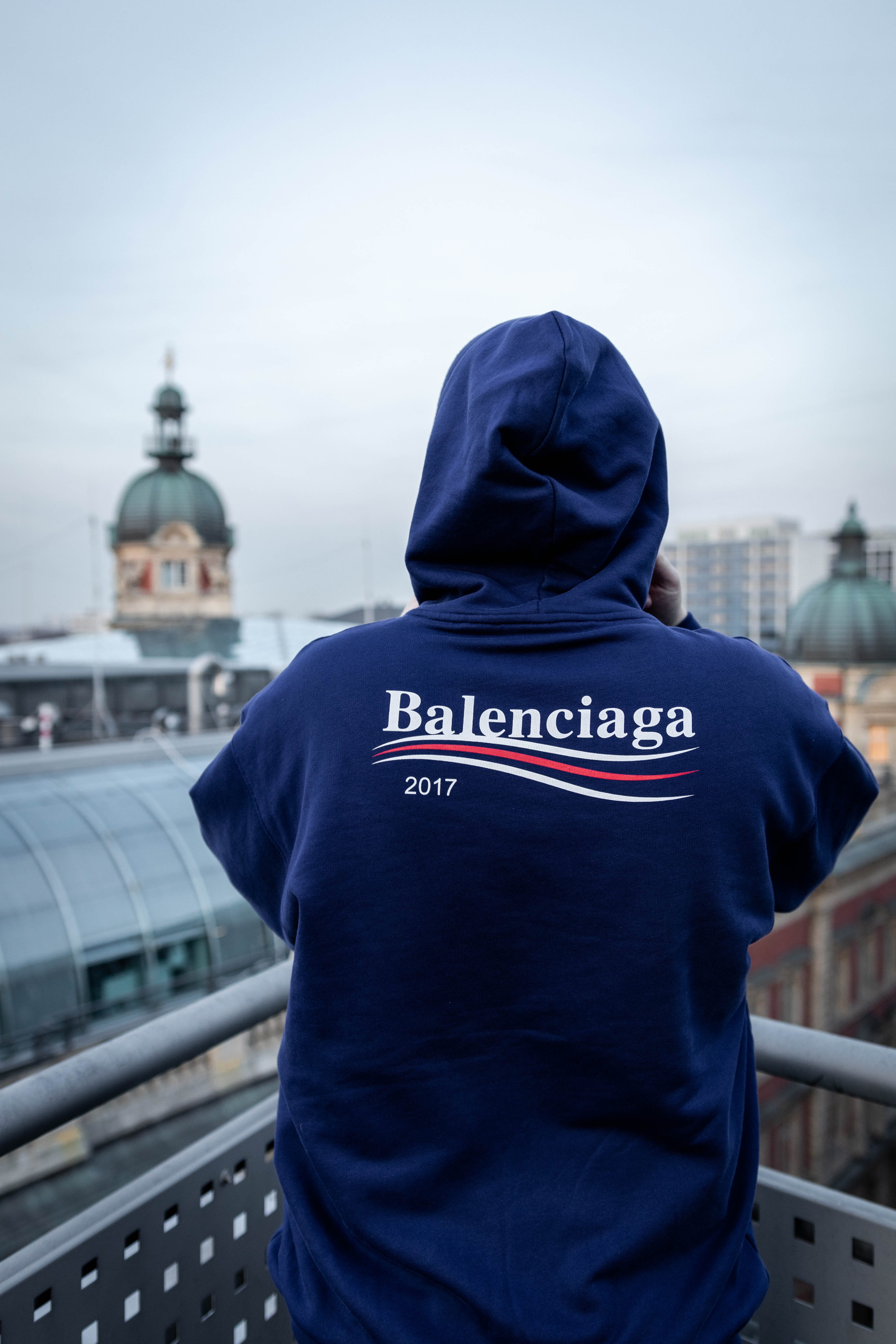 clothing, 2017, person, fashion, balenciaga2017, one person, waist up, hood, real people, day, rear view, 5K, white, uniform, human, building exterior, Phone HD Wallpaper