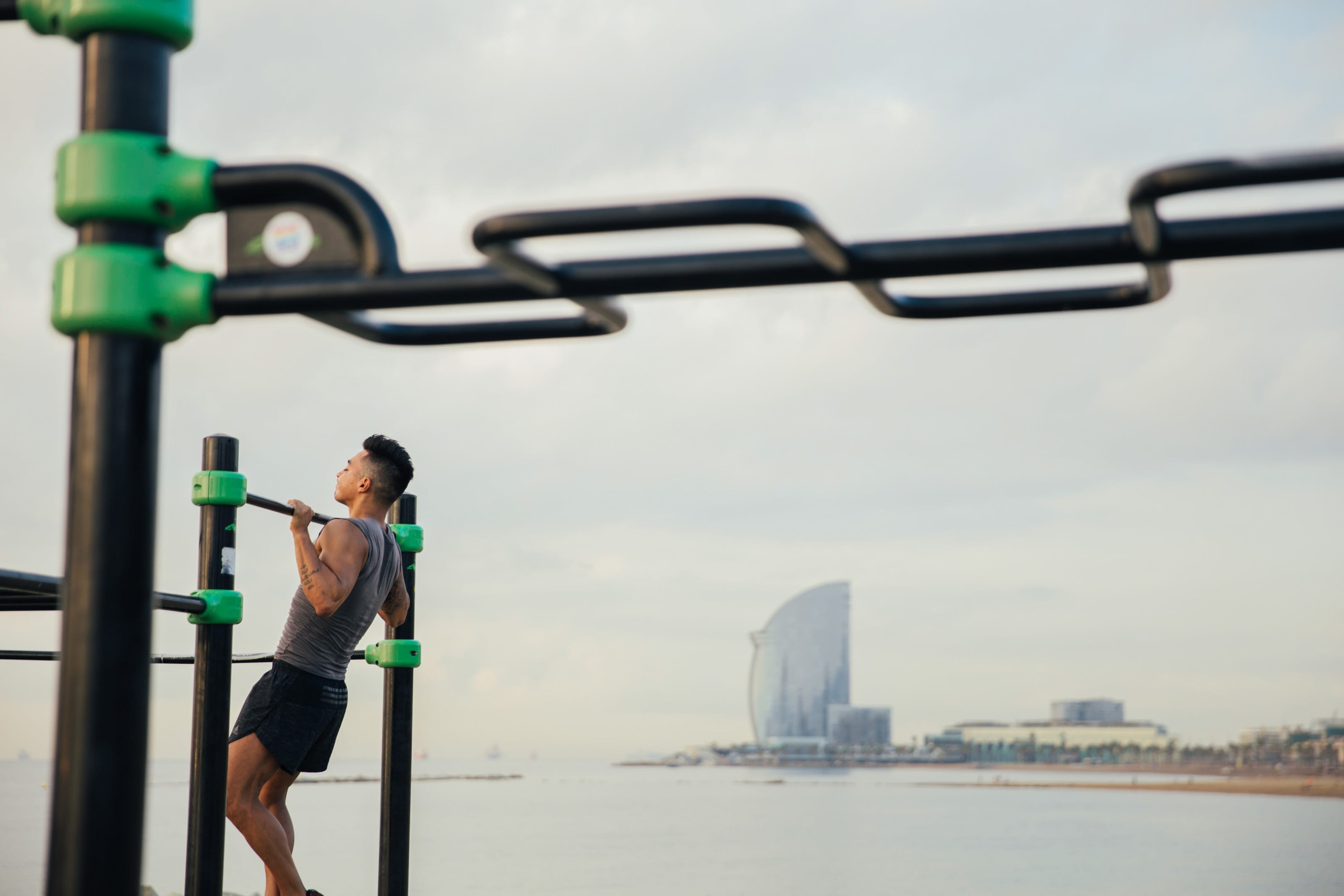 person, training, chin, workout bars, muscles, real people, muscular, young, casual clothing, chin-up, building exterior, power, Adult, physical fitness, HD Wallpaper