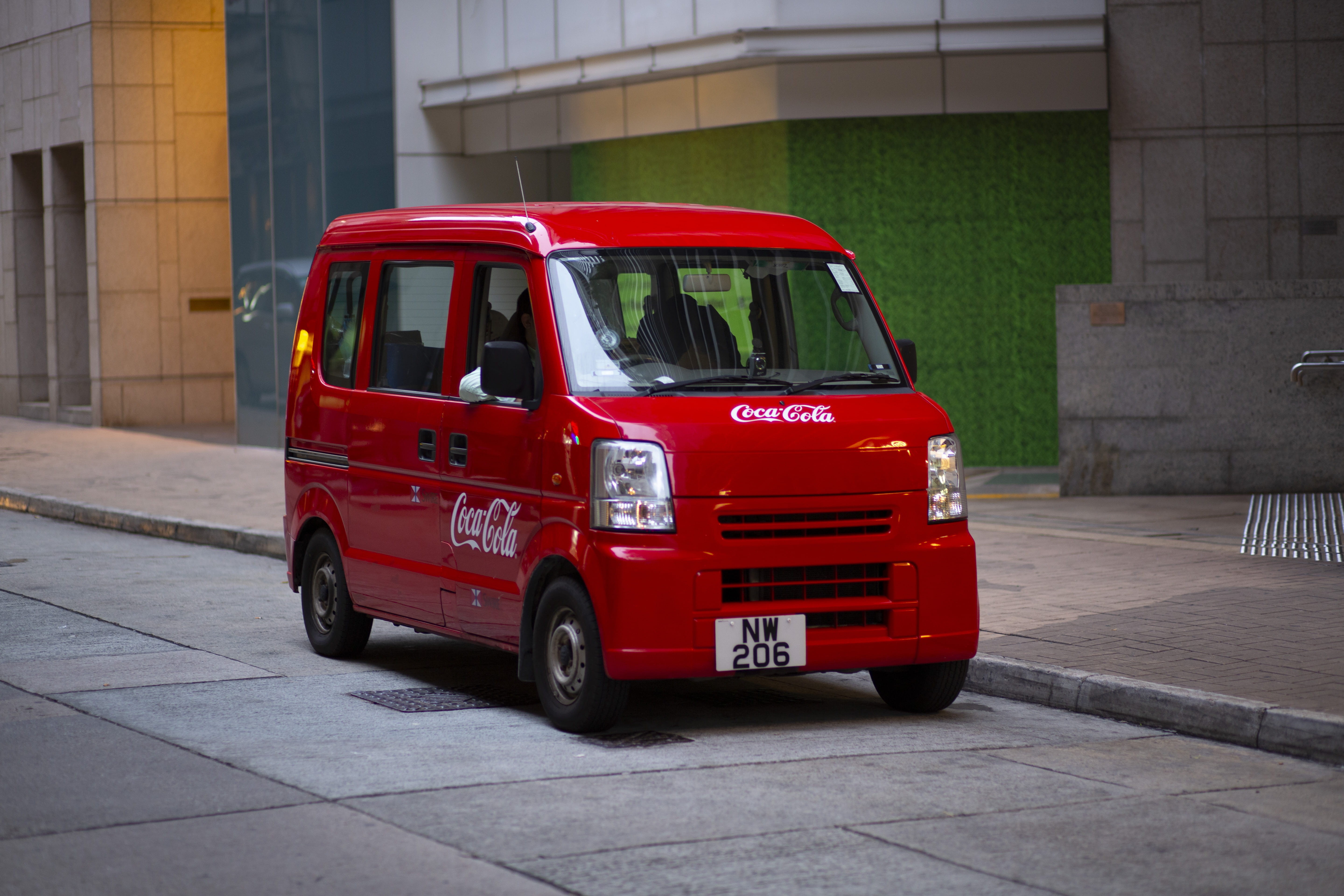 sign, red, vehicle, city, public transportation, bus, land vehicle, outdoors, motor vehicle, moving van, focus on foreground, minibus, van, truck, machine, HD Wallpaper