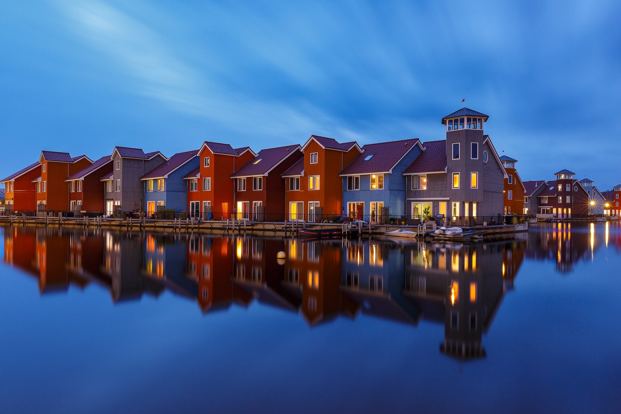 lake, reflection, nature, cyan, calm, water, symmetry, no people, boat houses, blue, illuminated, sky, row house, cloud - sky, 1080P, built structure, HD Wallpaper