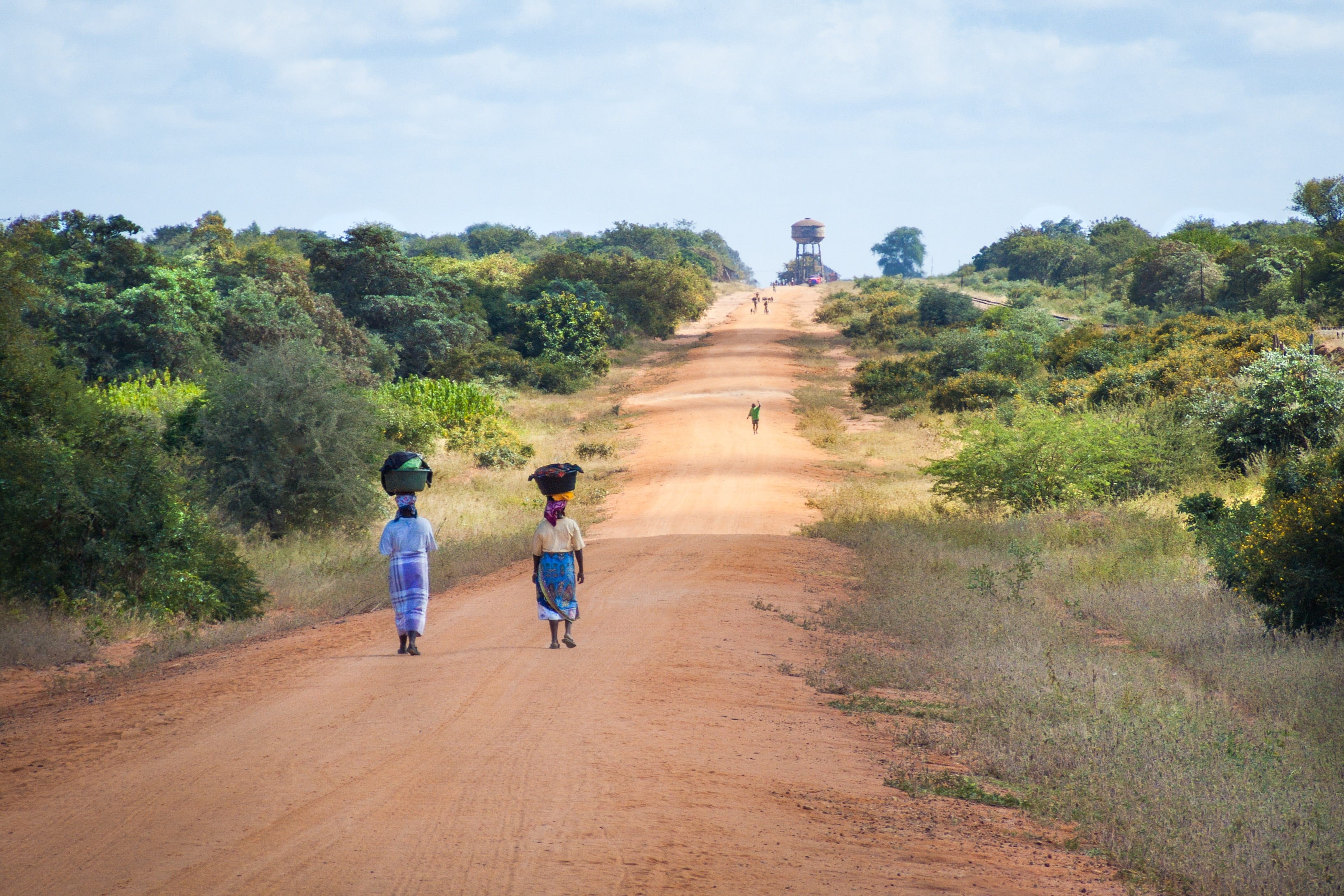 african women walking along road, dirt road, transportation, day, rear view, adult, nature, two people, walking, mozambique, childhood, men, the way forward, HD Wallpaper