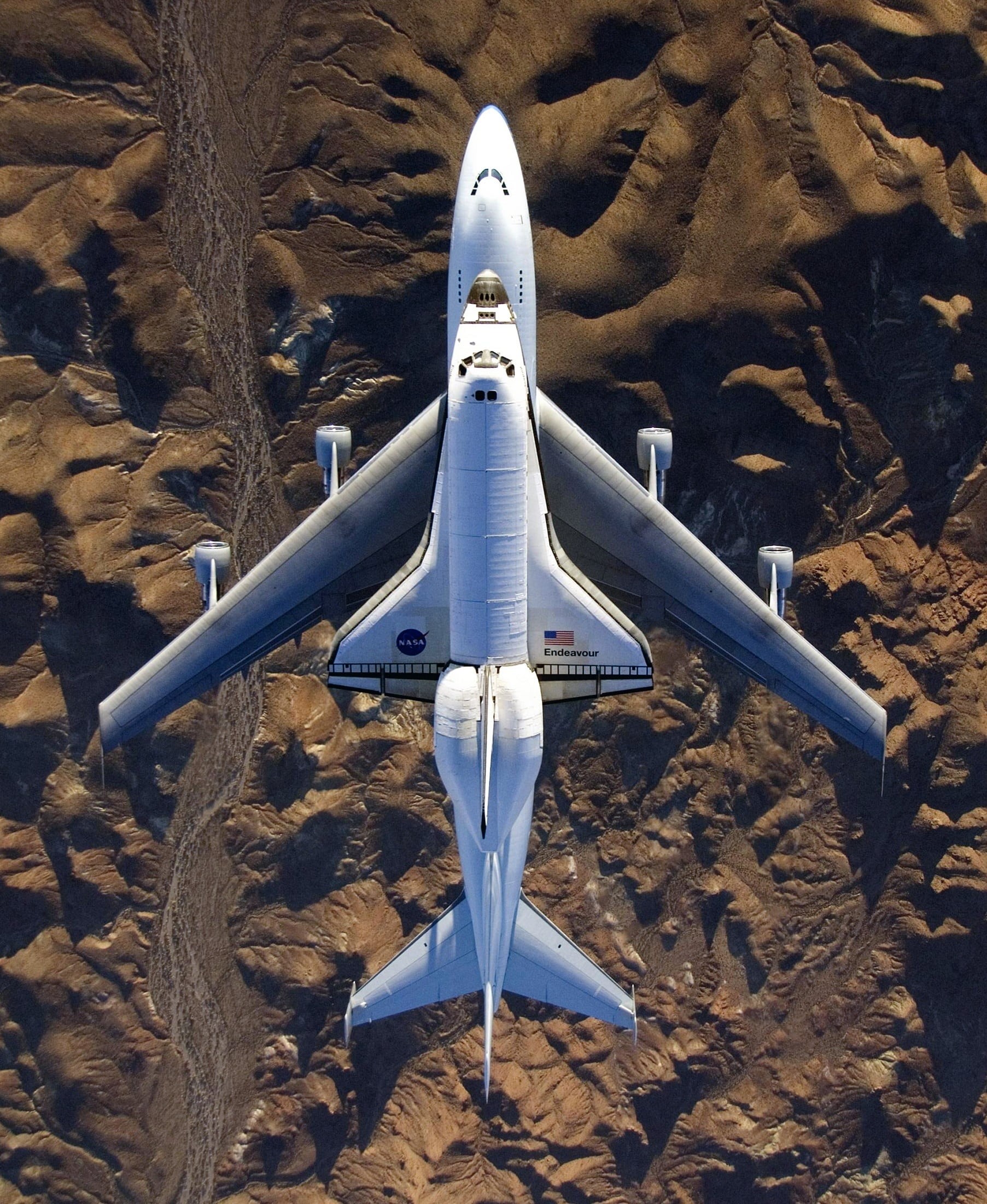 transportation, air vehicle, 1080P, rock formation, metal, flying, no people, airplane, plane, high angle view, california, fly, carrier, boeing 747, shuttle carrier, Phone HD Wallpaper