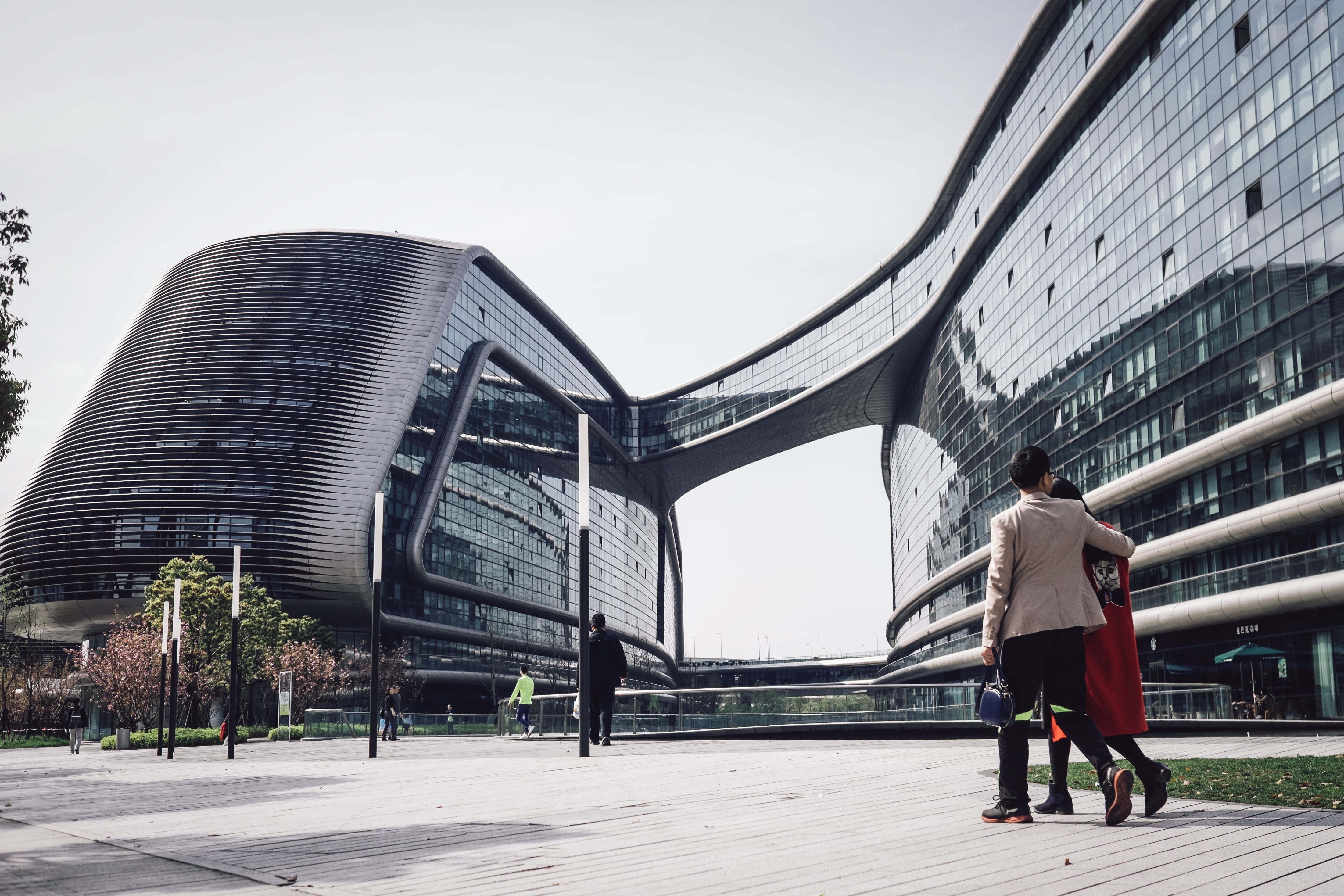 walking, incidental people, men, bridge, adult, jacket, great modern building, building, one person, windows, woman, suit, zaha hadid, rear view, bridge - man made structure, HD Wallpaper