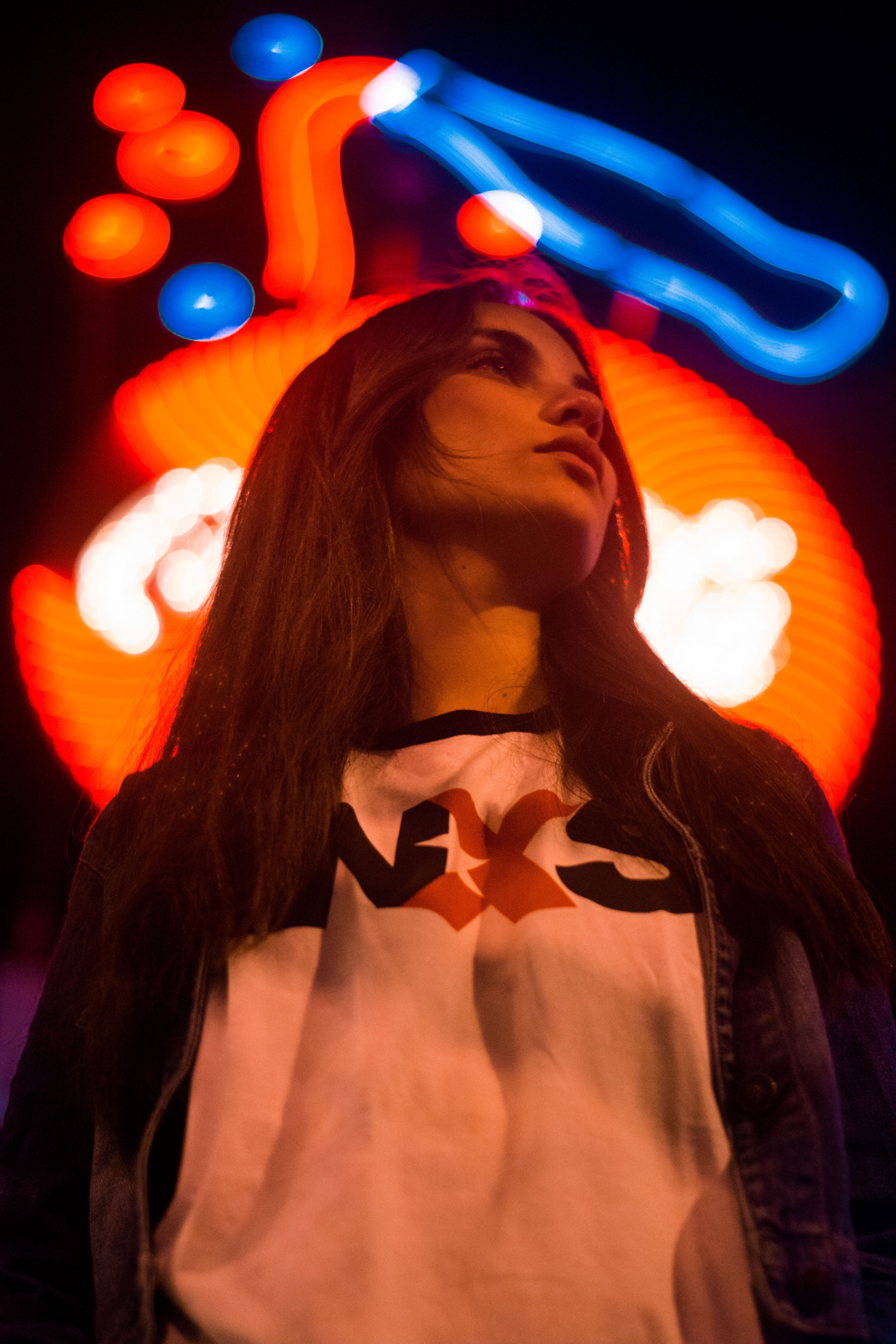 young women, low light, front, illuminated, one person, contemplation, neonoir, light, indoors, adult, inx, signage, looking, black, photo, girl, white, Phone HD Wallpaper