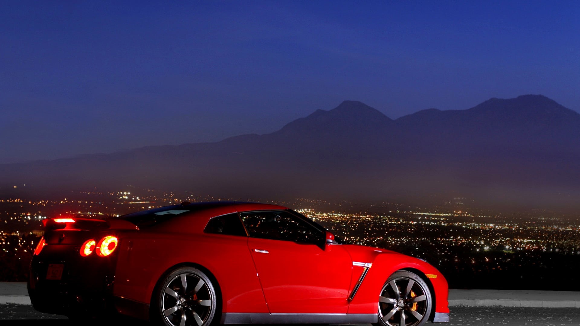 stationary, mountains, Nissan, coupe, night, copy space, outdoors, lights, illuminated, transportation, red cars, road, clear sky, vehicle, architecture, HD Wallpaper