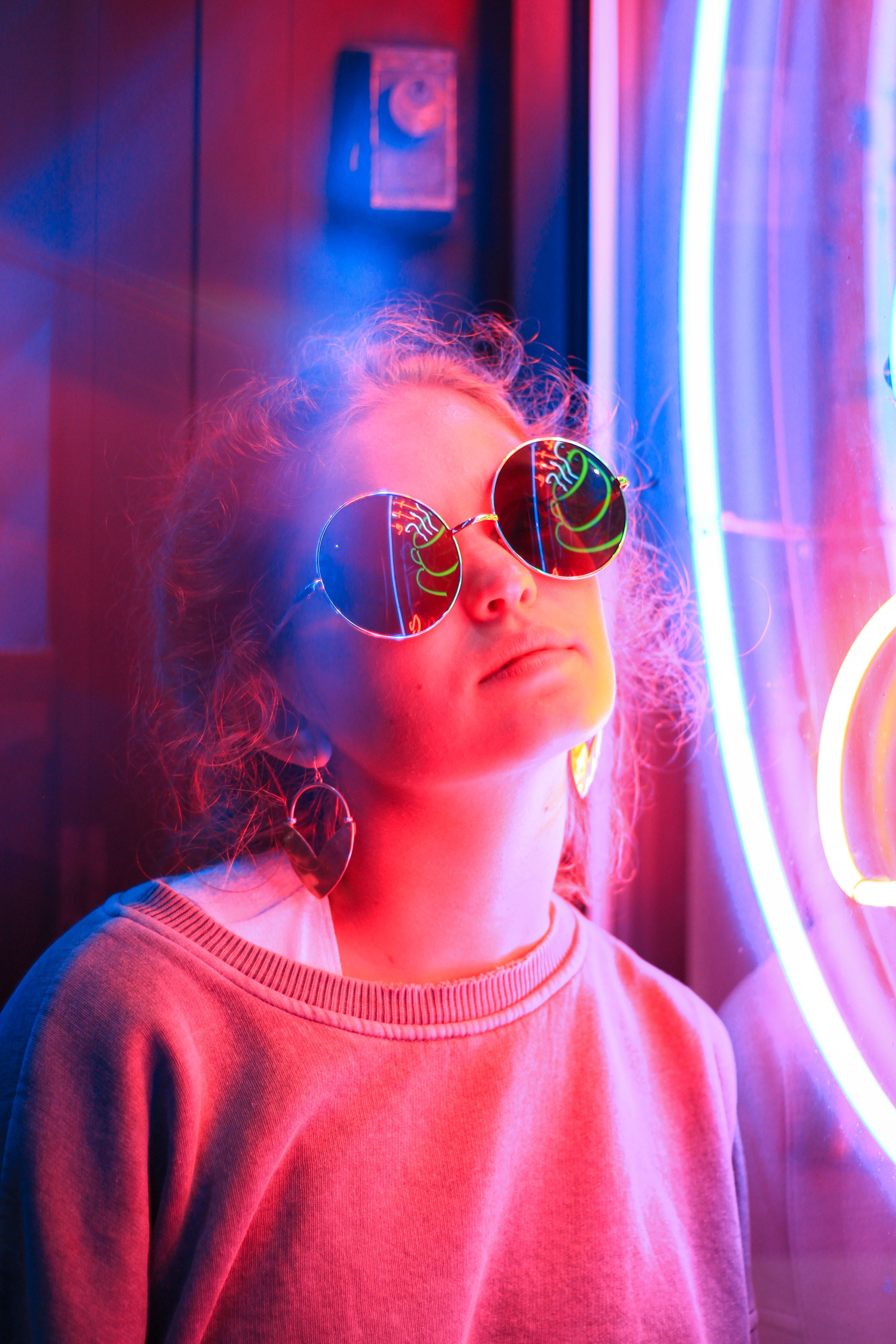 women, woman, beautiful woman, angle, sign, glass, adult, waist up, girl, illuminated, bright, headshot, light, florescent, young women, real people, sunglasses, Phone HD Wallpaper