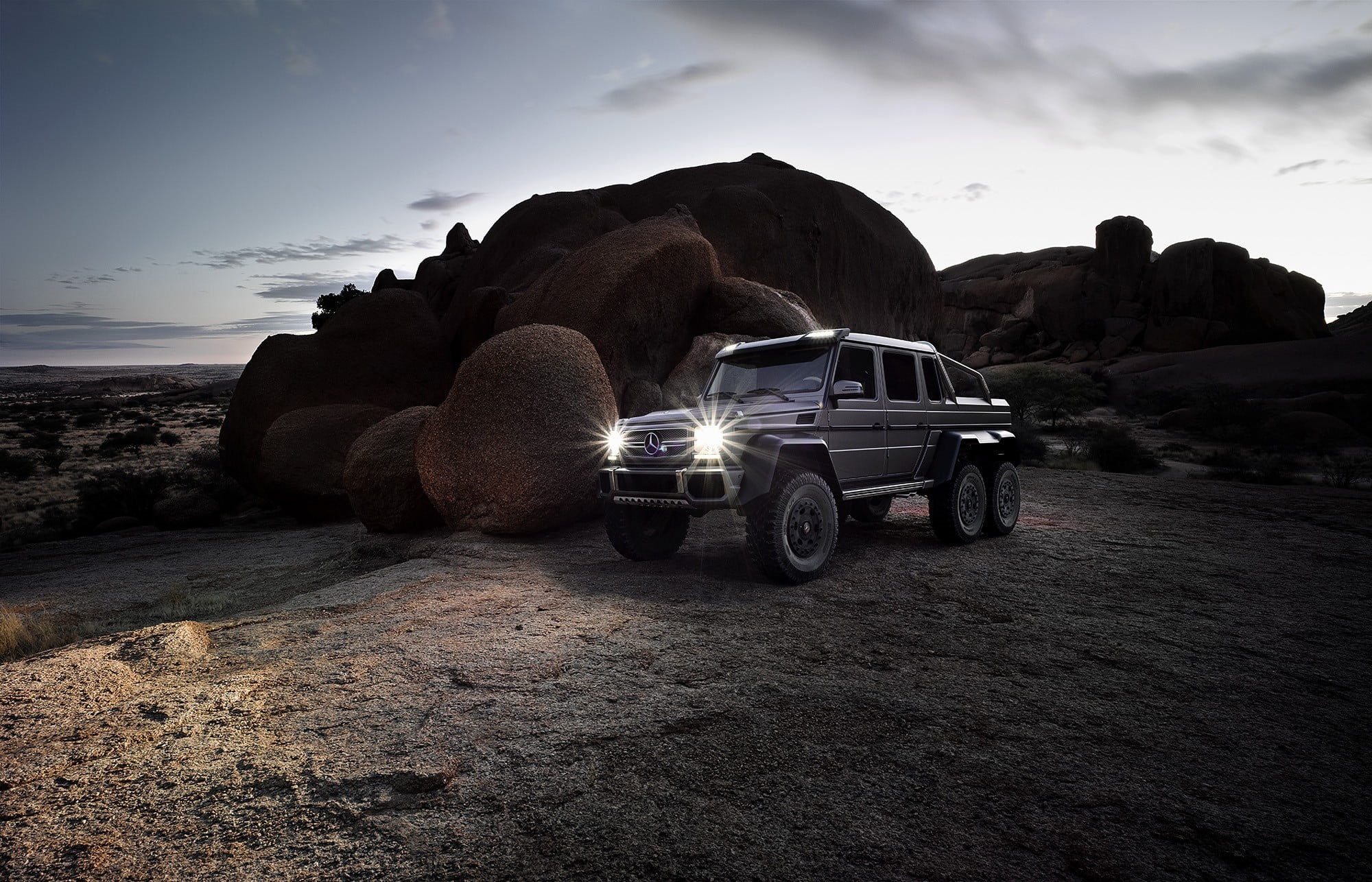 outdoors, gray, benz, g, Mercedes-Benz, trucks, no people, nature, solid, road, rock, cloud - sky, wheel, transportation, 1080P, car, land, 6x6, scenics - nature, HD Wallpaper