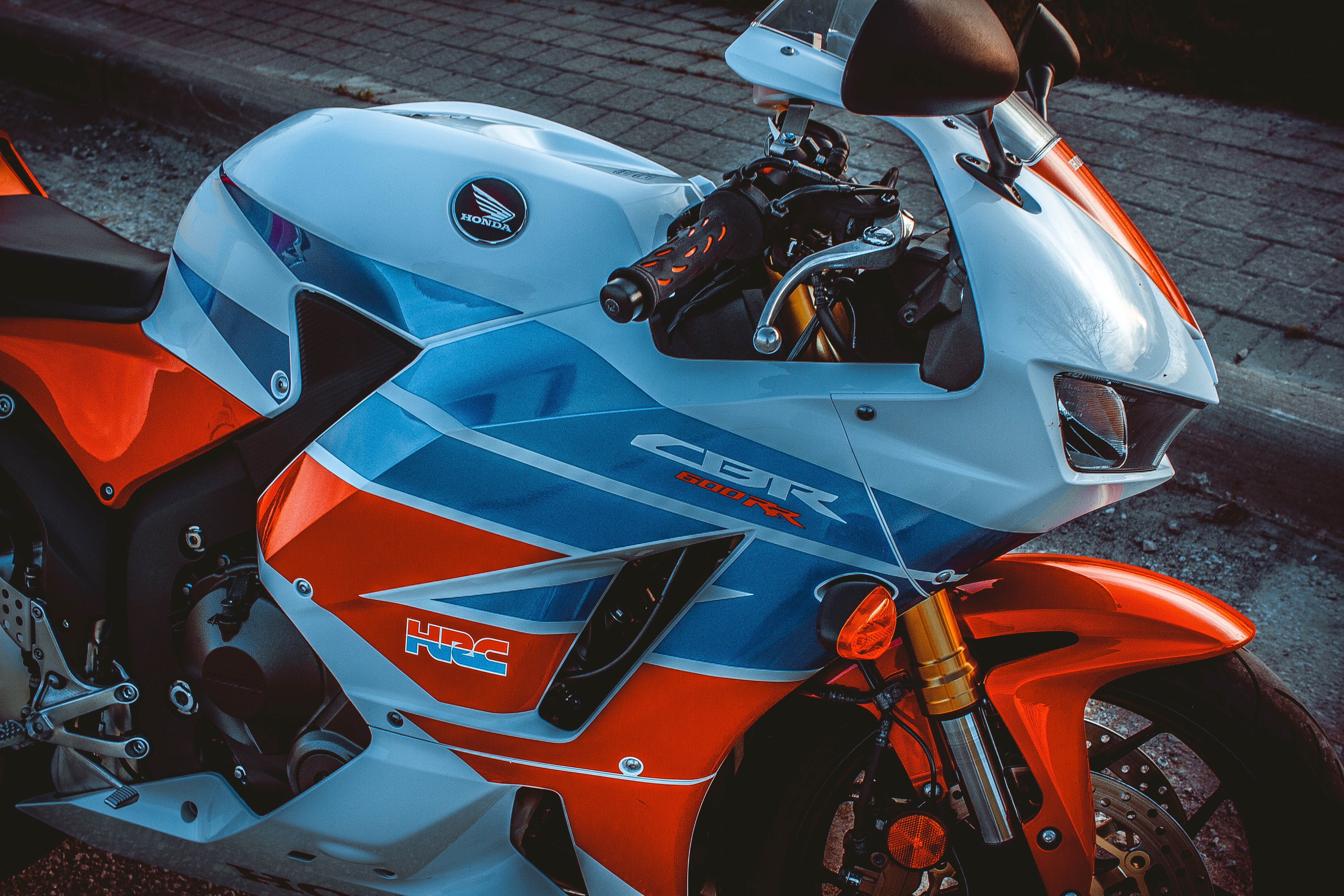 motorcycle, clothing, crash helmet, day, wheel, apparel, motor scooter, cbr, helmet, mode of transportation, outdoors, blue, spoke, no people, alloy wheel, HD Wallpaper