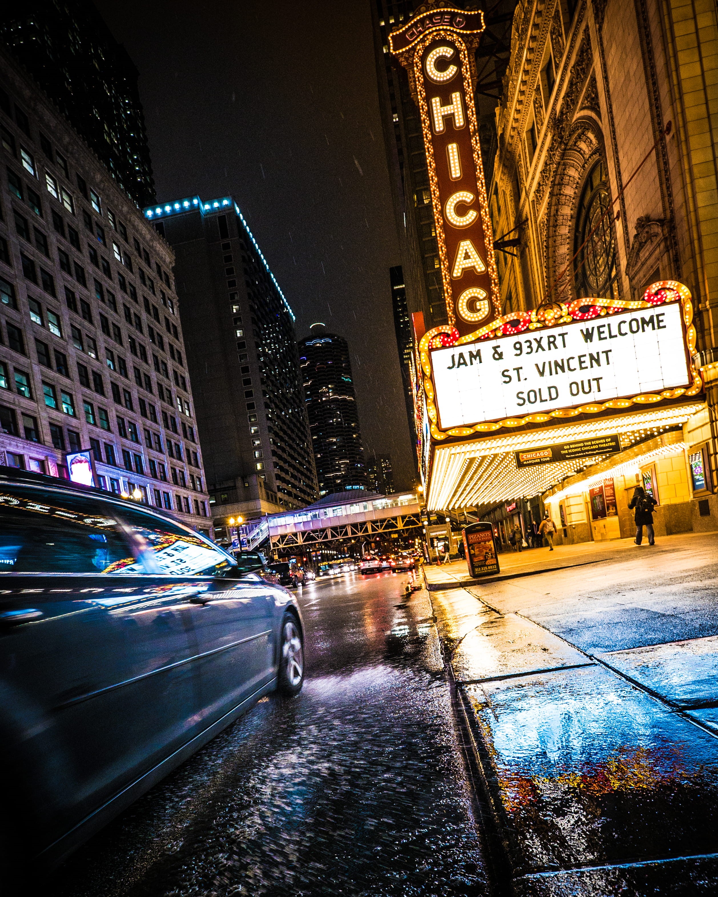 chicago theatre, illuminated, motor vehicle, architecture, road, city street, city life, land vehicle, rain, nighttime, people, signage, building exterior, Phone HD Wallpaper