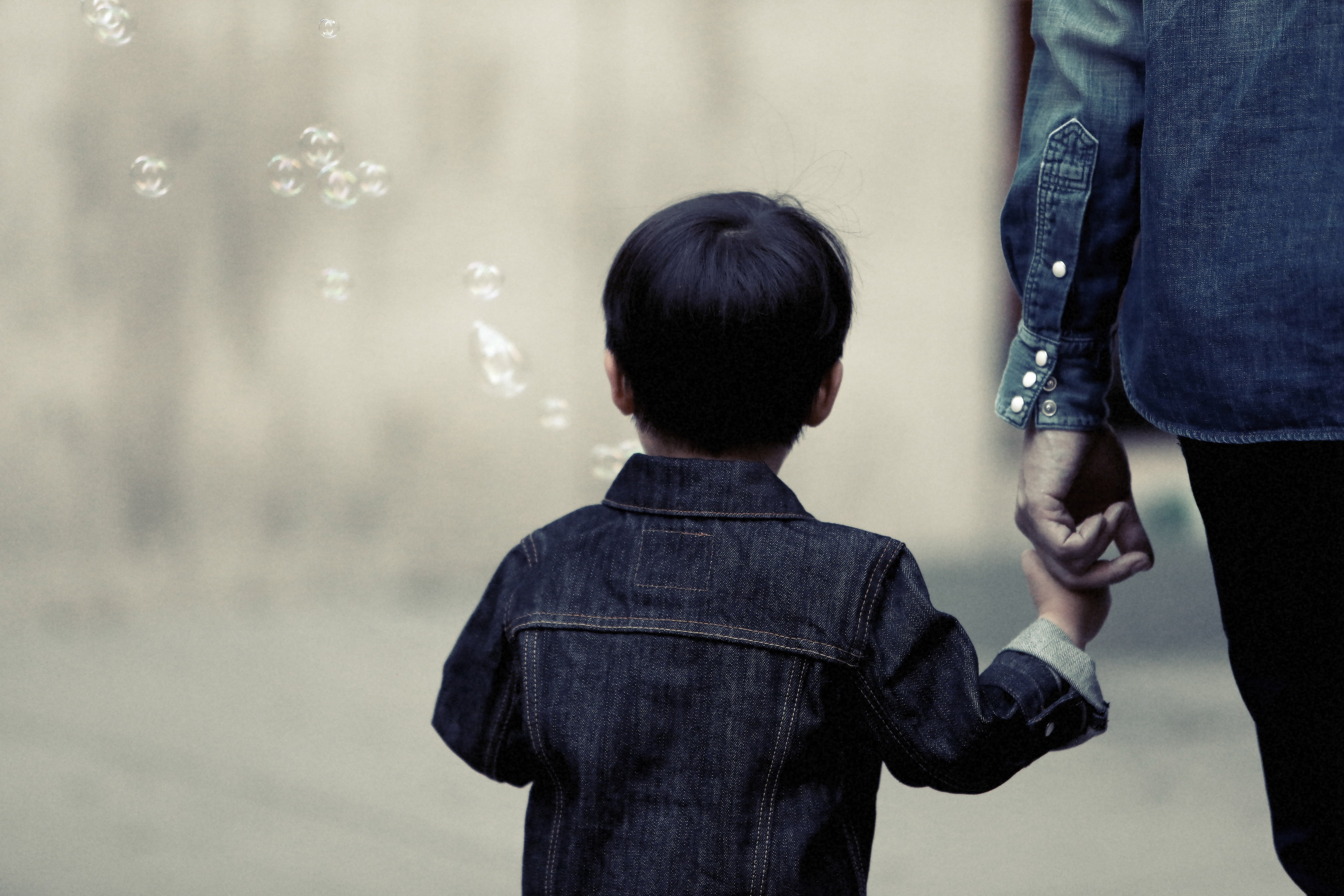 adult, childhood, walking, holding, kid, mother, standing, jacket, casual clothing, person, rear view, bubbles, blowing, focus, togetherness, child, two people, HD Wallpaper