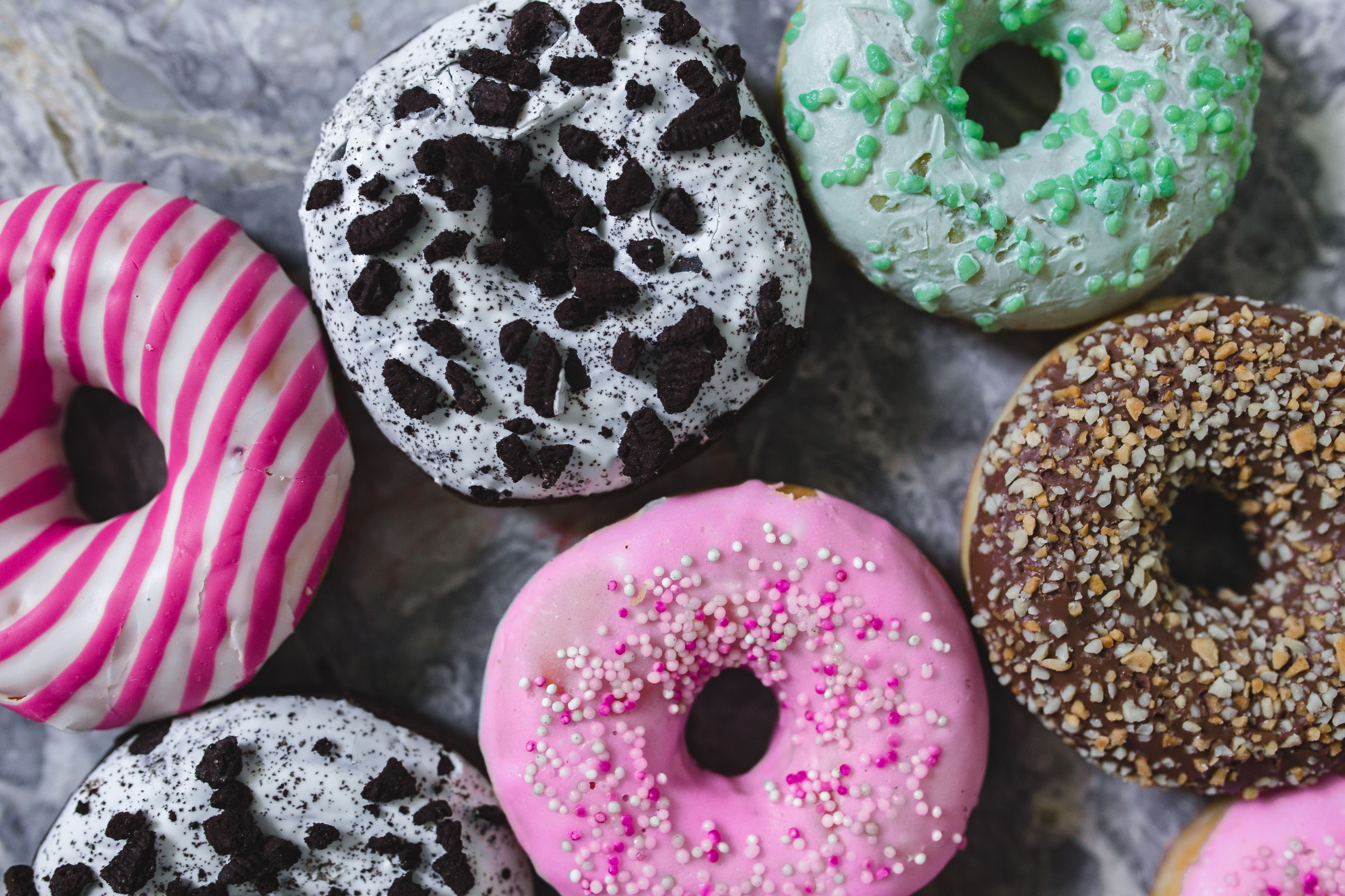baked, indoors, dessert, food, icing, delicious, choice, cake, pastry, junk food, Colorful, glazed, pink color, gourmet, close-up, indulgence, 5K, donuts, HD Wallpaper