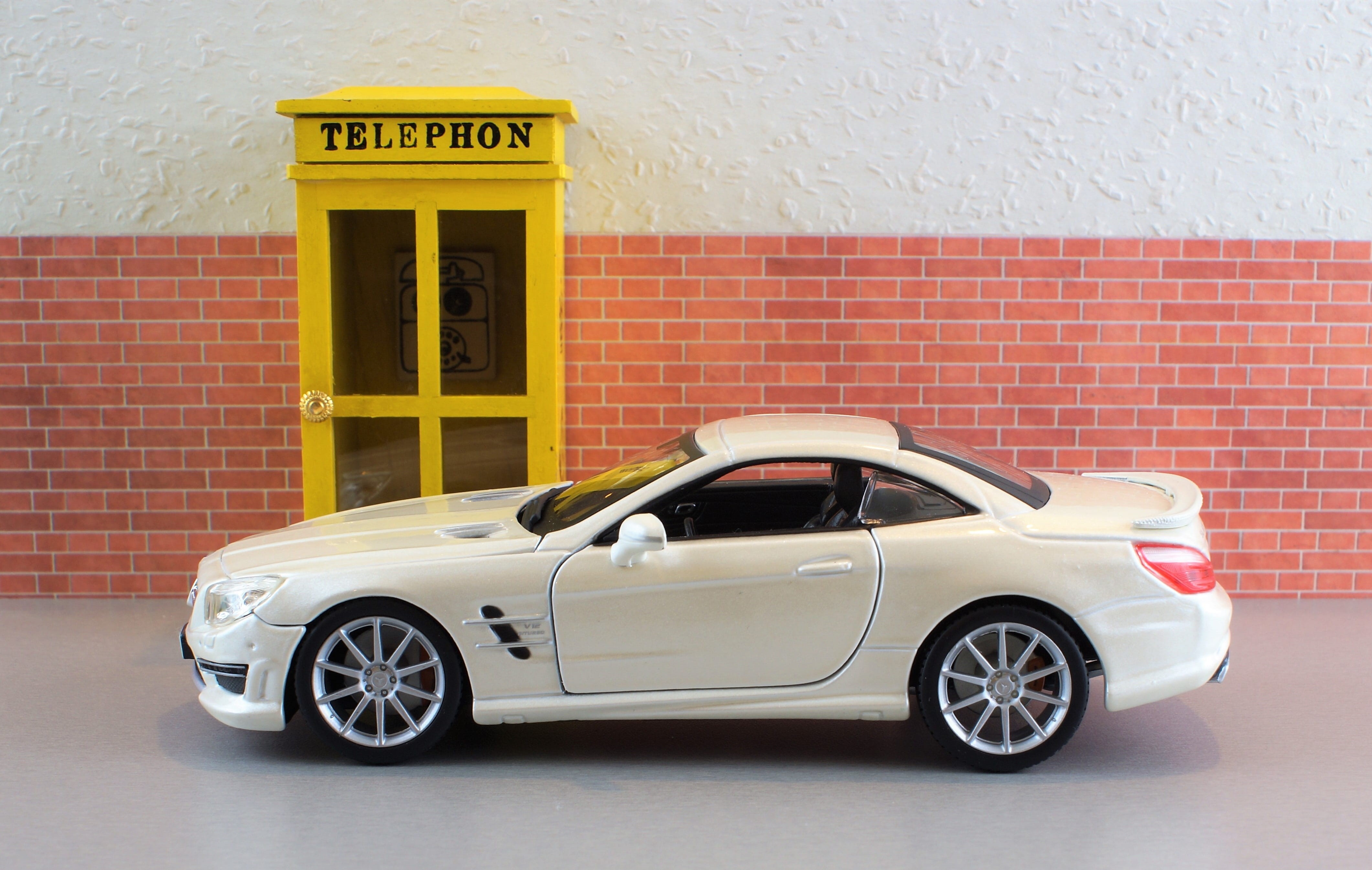 wall, car, nostalgic, day, dispensary, Amg, dare, sl, built structure, automotive, land vehicle, model, communication, yellow, mode of transportation, phone booth, HD Wallpaper