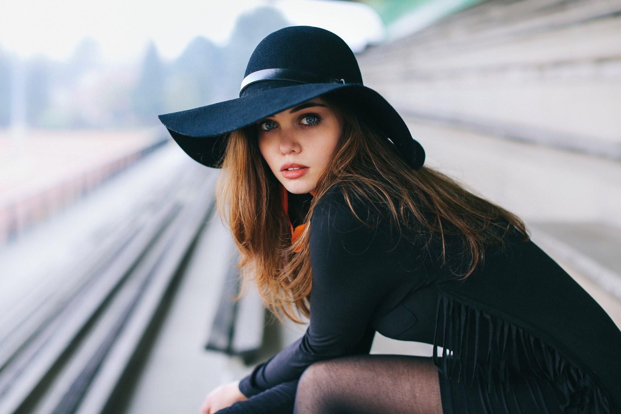 face, model, women, auburn hair, blue eyes, brunette, 1080P, train station, black outfits, bokeh, David Olkarny, portrait, hat, HD Wallpaper