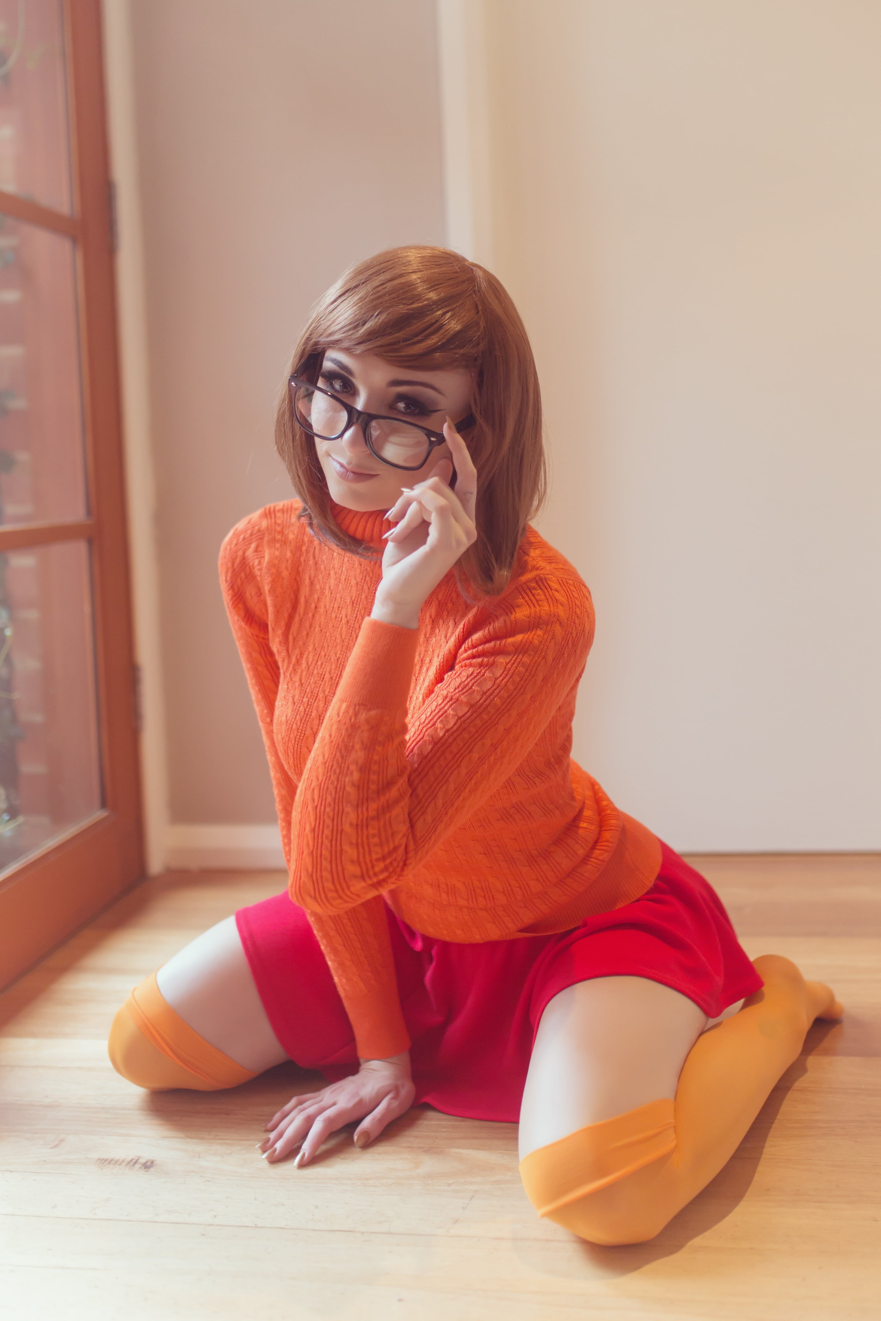 telephone, women indoors, sitting, contemplation, smiling, sweater, human Face, scooby, wilma, fashion, eyeglasses, Kayla Erin, relaxation, looking at viewer, Phone HD Wallpaper