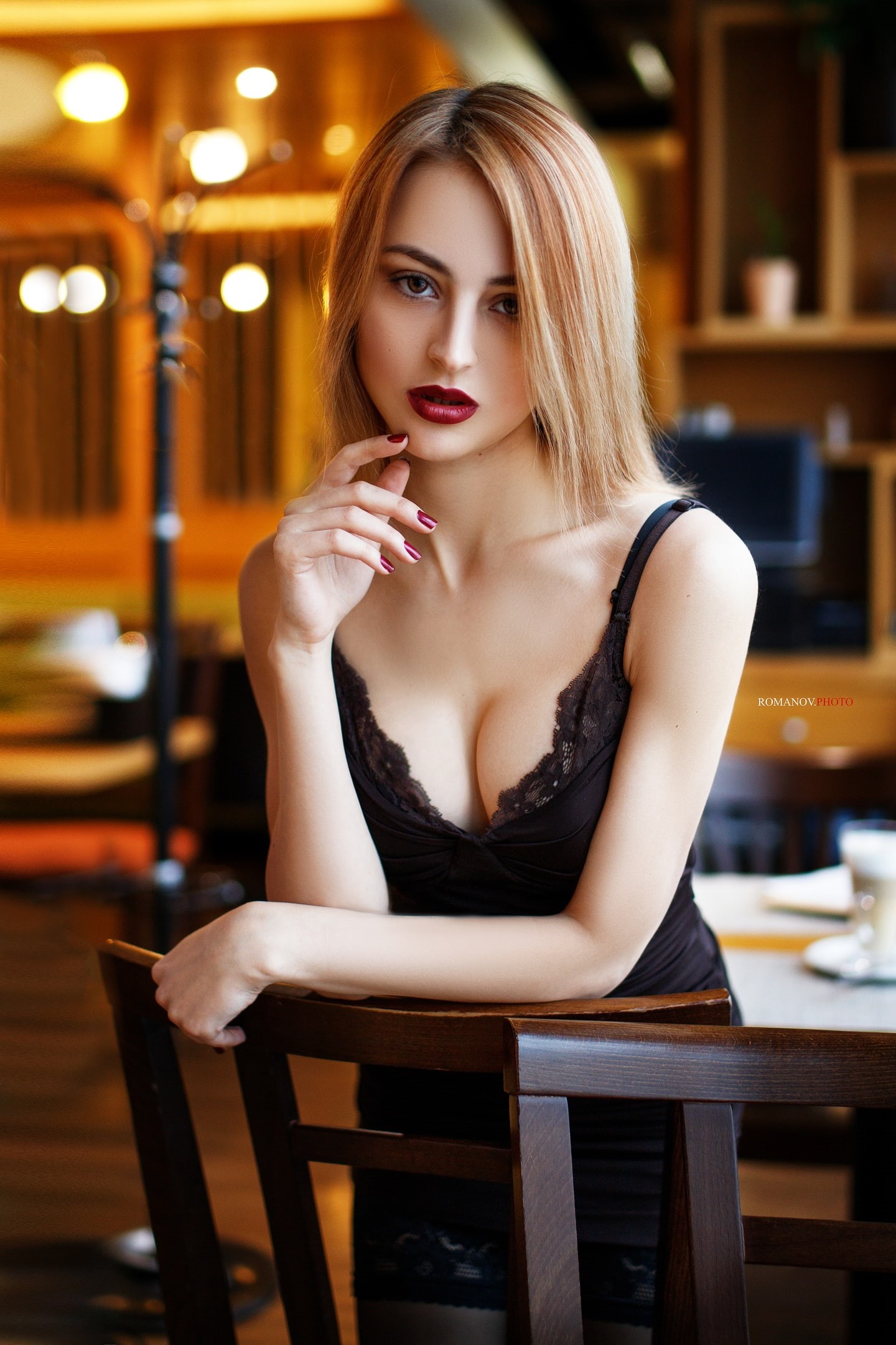 blonde, brown eyes, 1080P, portrait display, Maksim Romanov, dress, stockings, women indoors, red lipstick, red nails, chair, depth of field, black dress, Phone HD Wallpaper