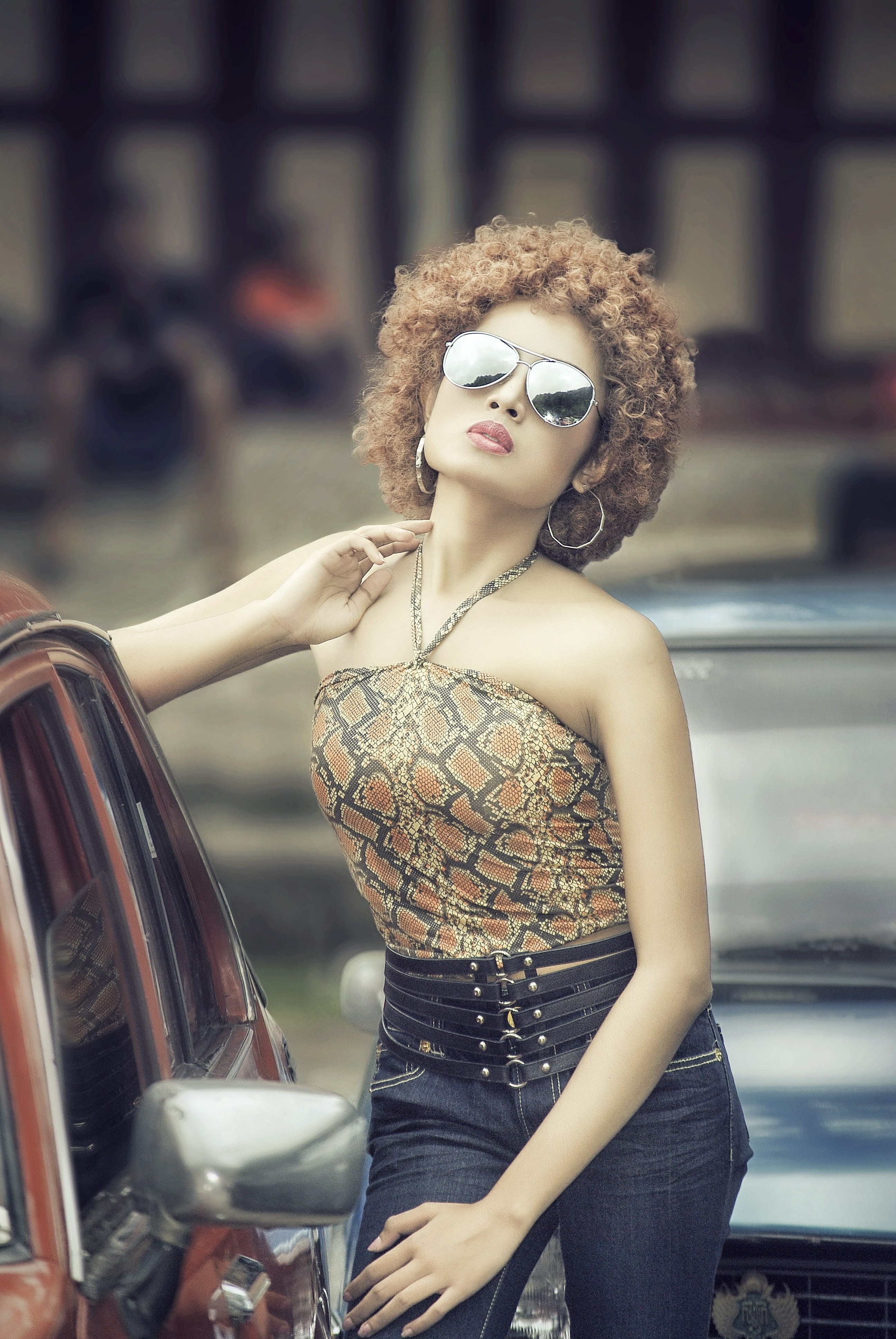 model, blue, brown, 4K, three quarter length, hair, black, focus on foreground, car, curly hair, near, young women, luxury, beauty, vehicle, hairstyle, Phone HD Wallpaper
