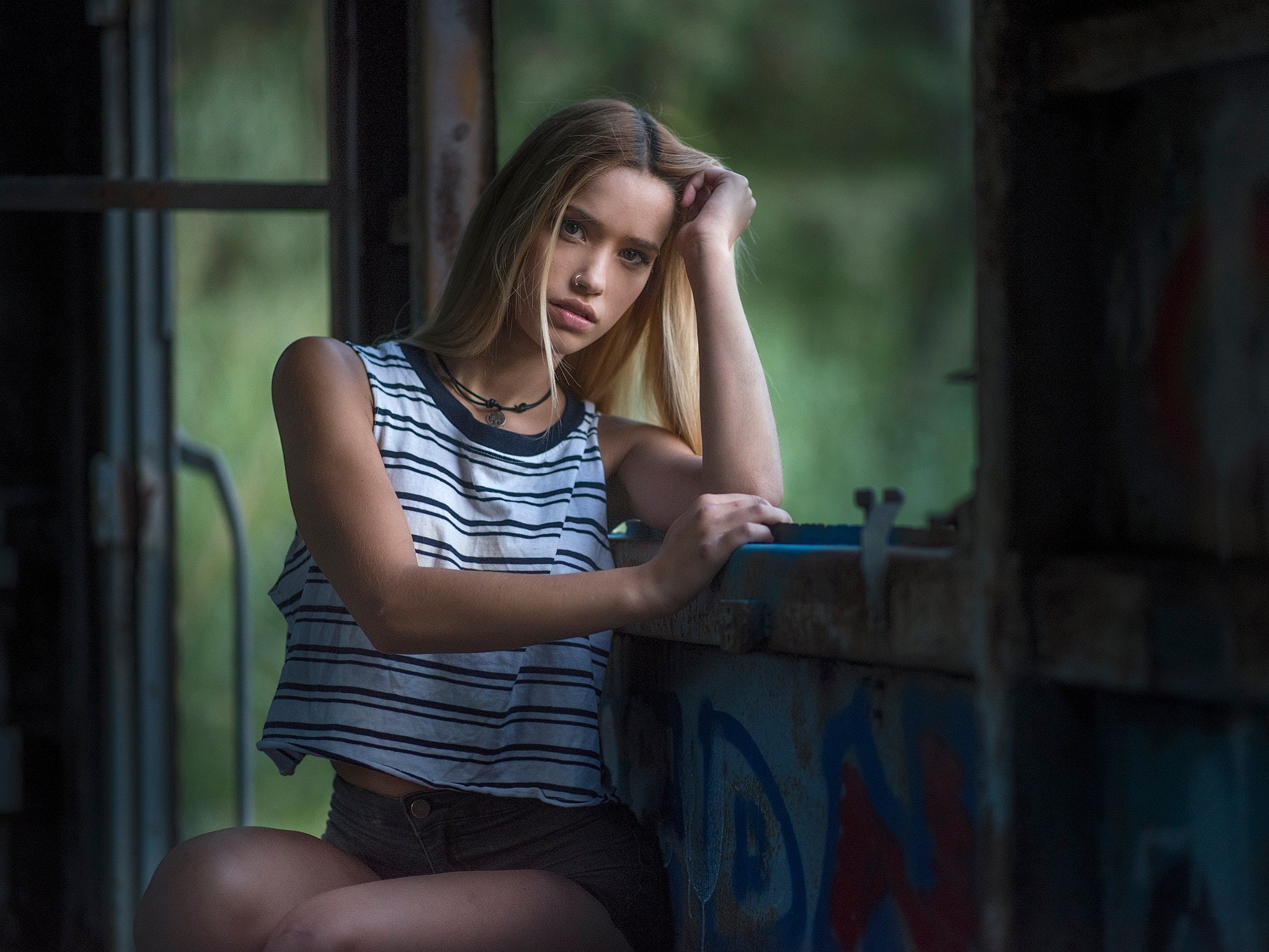 women, teenager, outdoors, 1080P, jean shorts, emotion, distraught, contemplation, depth of field, nose rings, sitting, three quarter length, T-shirt, HD Wallpaper