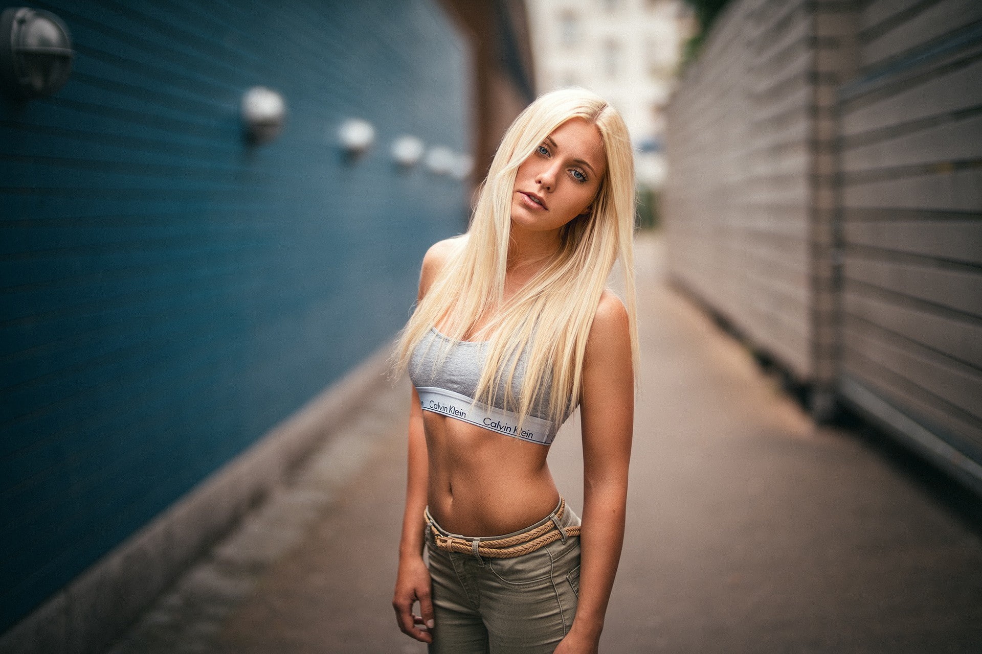 1080P, depth of field, model, pants, brunette, straight hair, sports bra, Sara Magdalena Deichsel, women, Calvin Klein, belly, long hair, looking at viewer, HD Wallpaper