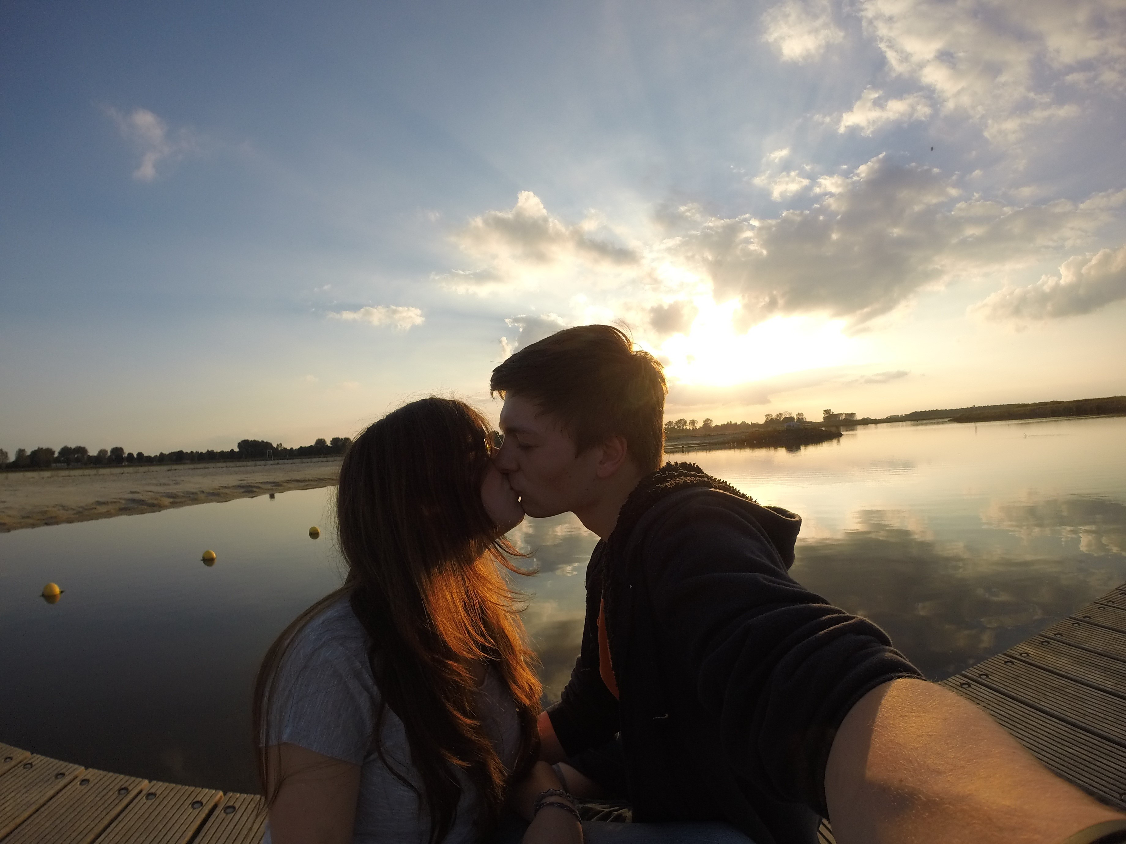 outdoors, standing, evening sky, happiness, man, 2K, females, mirroring, bonding, pair, netherlands, young couple, people, adult, sun, girl, two People, HD Wallpaper