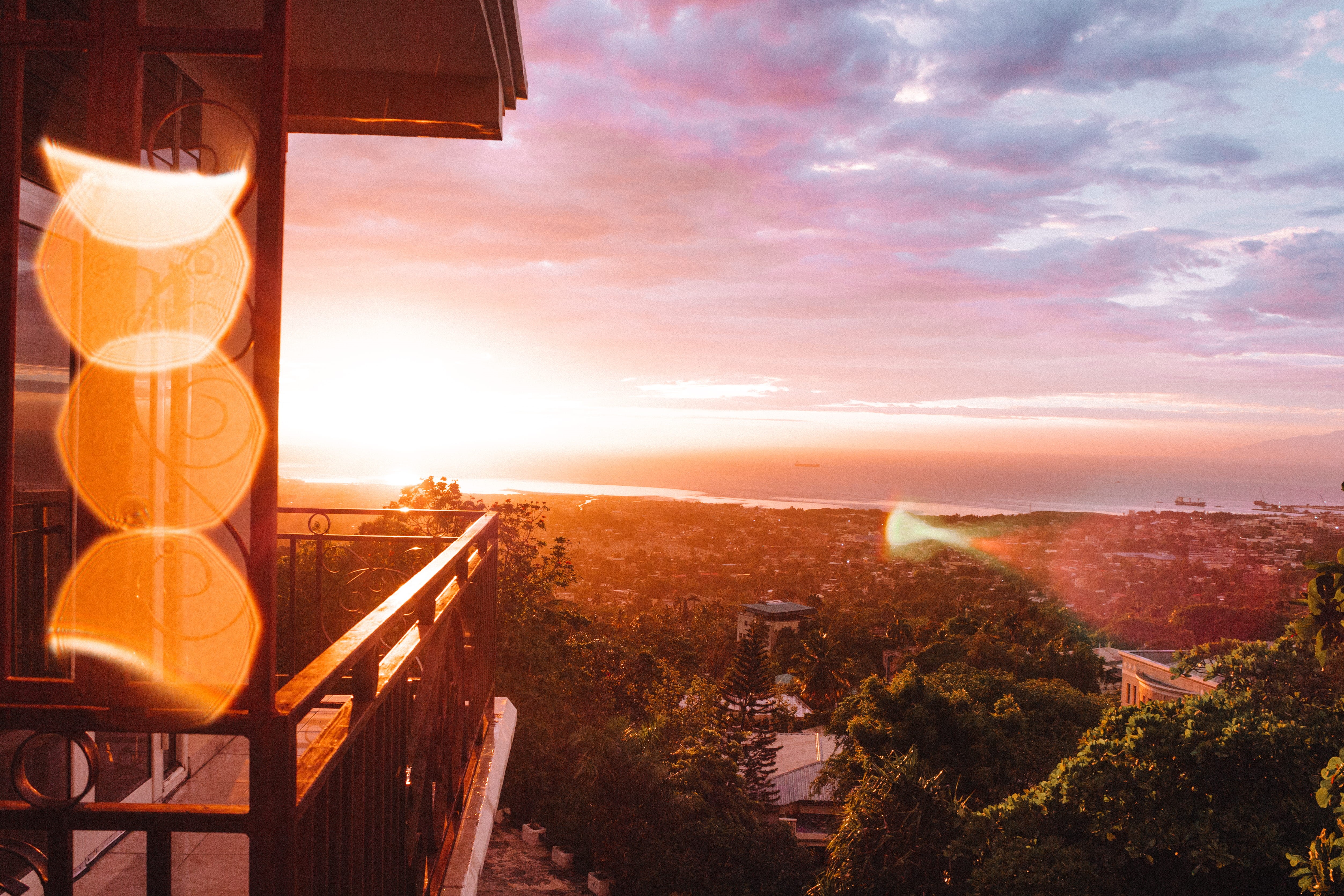 direction, city, room with a view, island life, bohemian, haiti, balcony, view, road, ocean, the way forward, pink sky, sky, tree, caribbean, tranquility, HD Wallpaper