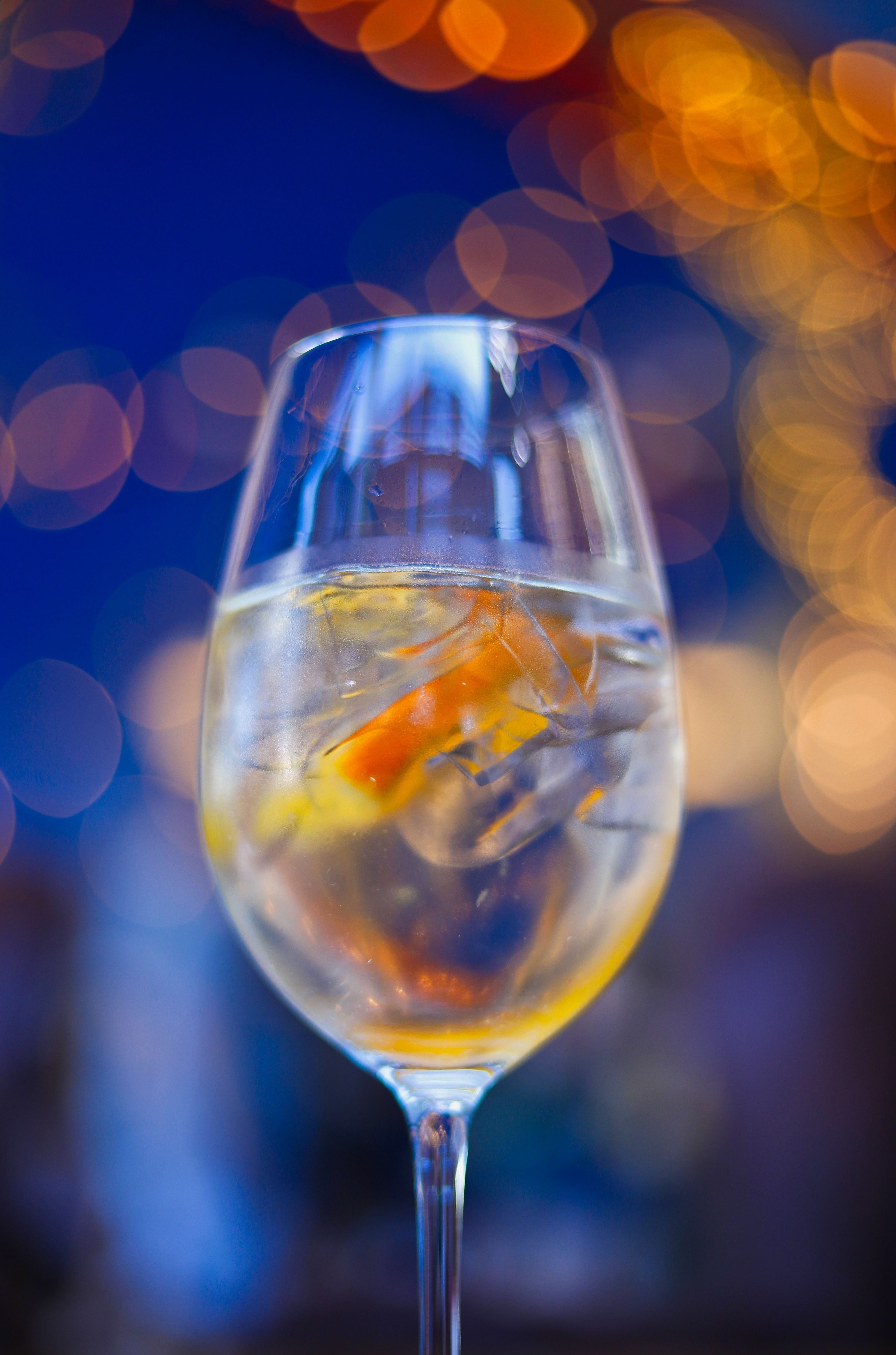 transparent, refreshment, table, glass, orange, illuminated, ice, switzerland, household equipment, food and drink, still life, no people, wineglass, photography, Phone HD Wallpaper