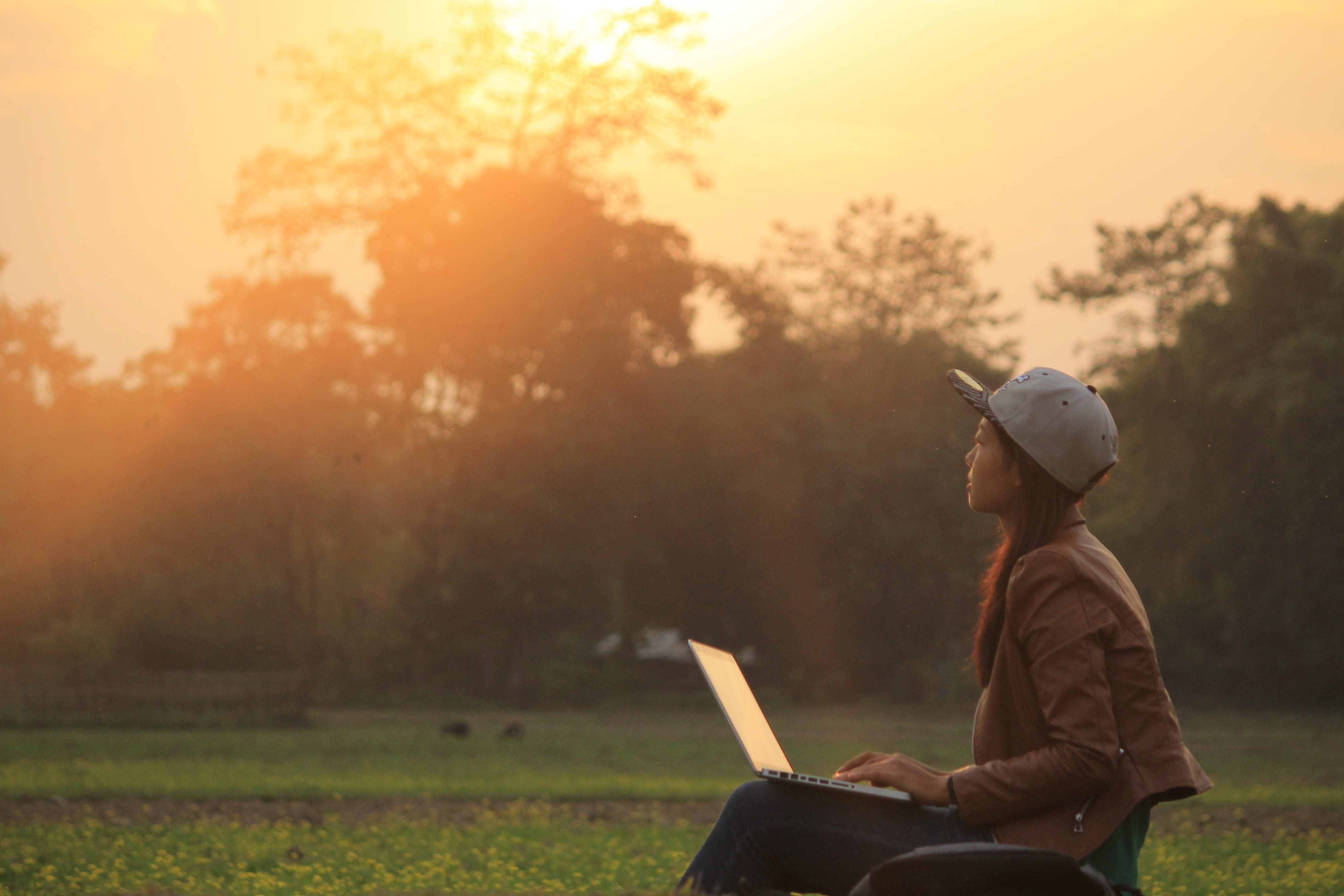 assamese, rays, sun, sunset, computer, grass, Sibsagar, lens flare, laptop, technology, men, wireless technology, three quarter length, plant, one person, HD Wallpaper