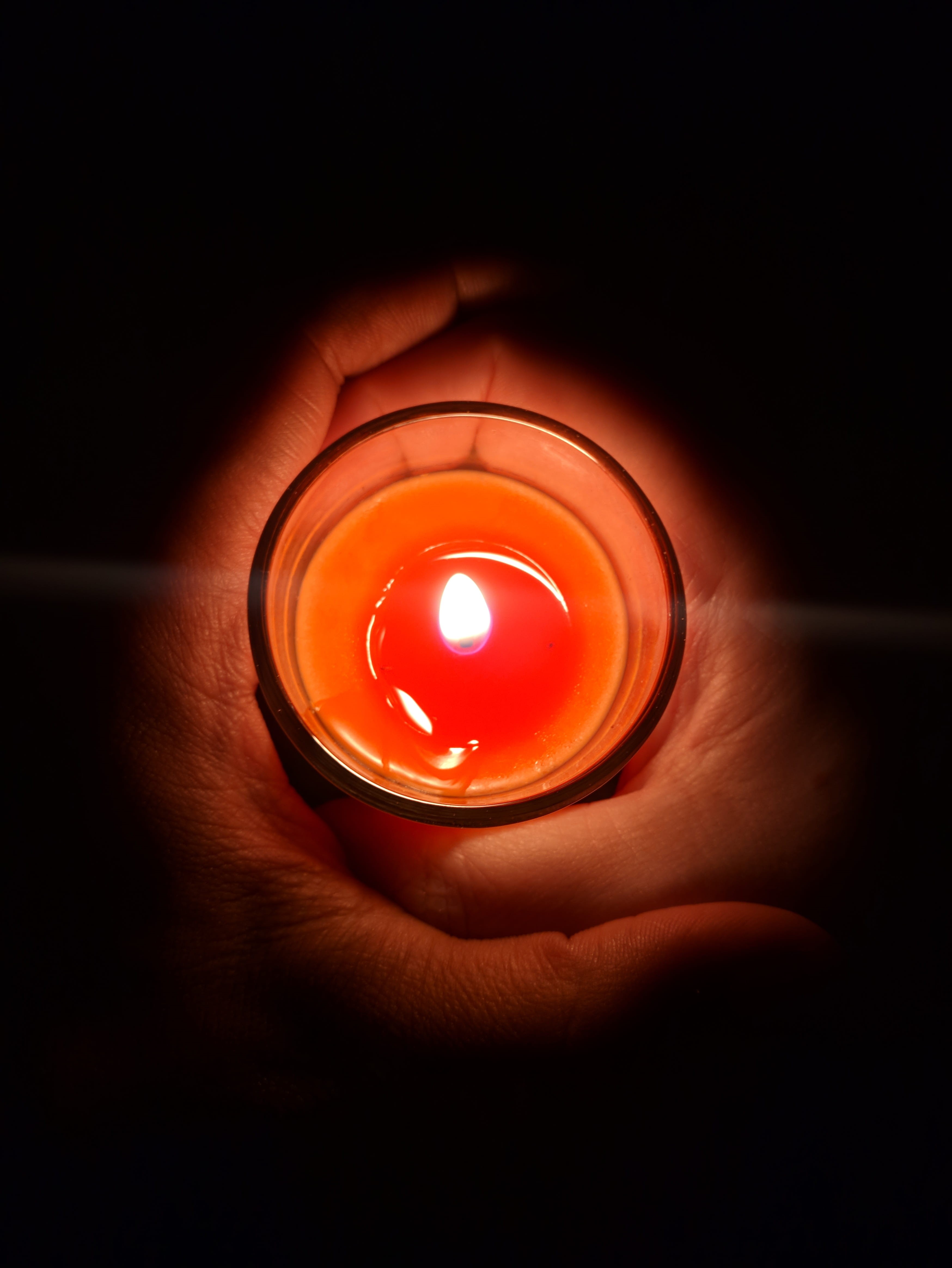 electric lamp, unrecognizable person, illuminated, glowing, fire - natural phenomenon, black background, indoors, dark, human hand, body part, burning, Phone HD Wallpaper