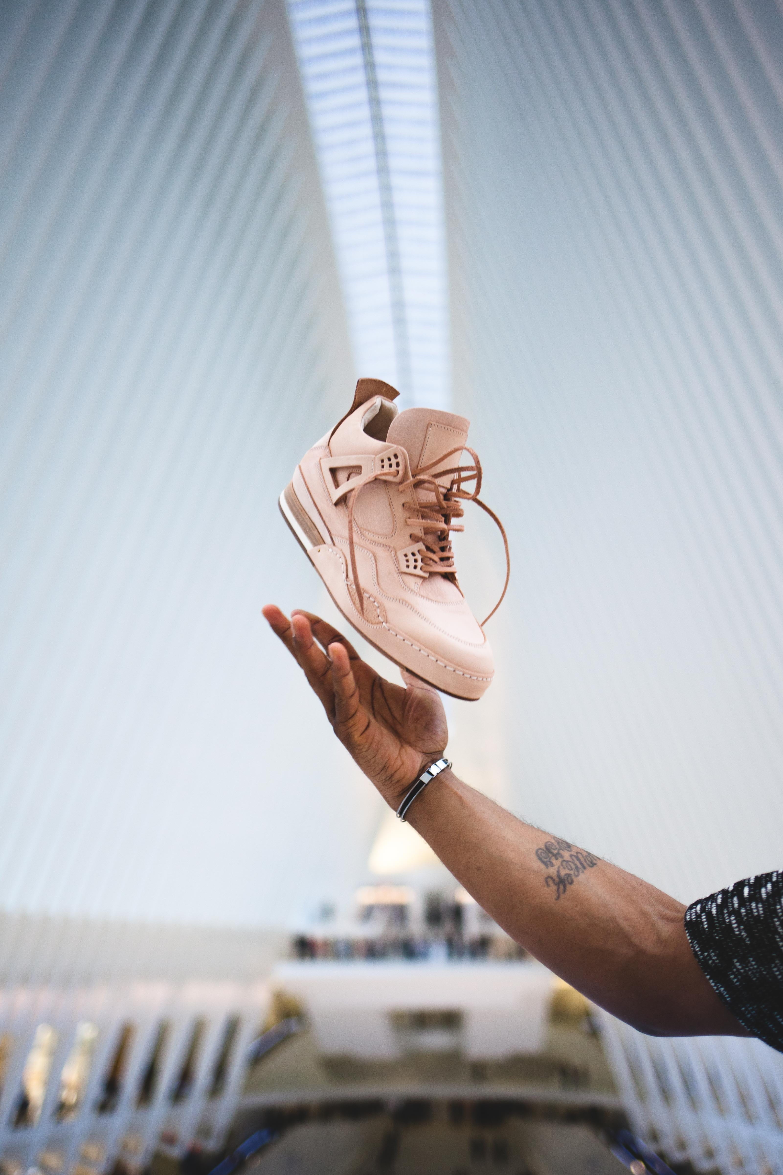 day, unpaired, holding, men, nyc, hand, jordan, shoe, sports, watch, unrecognizable person, product photo, modern shoe, finger, modern, human limb, focus on foreground, Phone HD Wallpaper