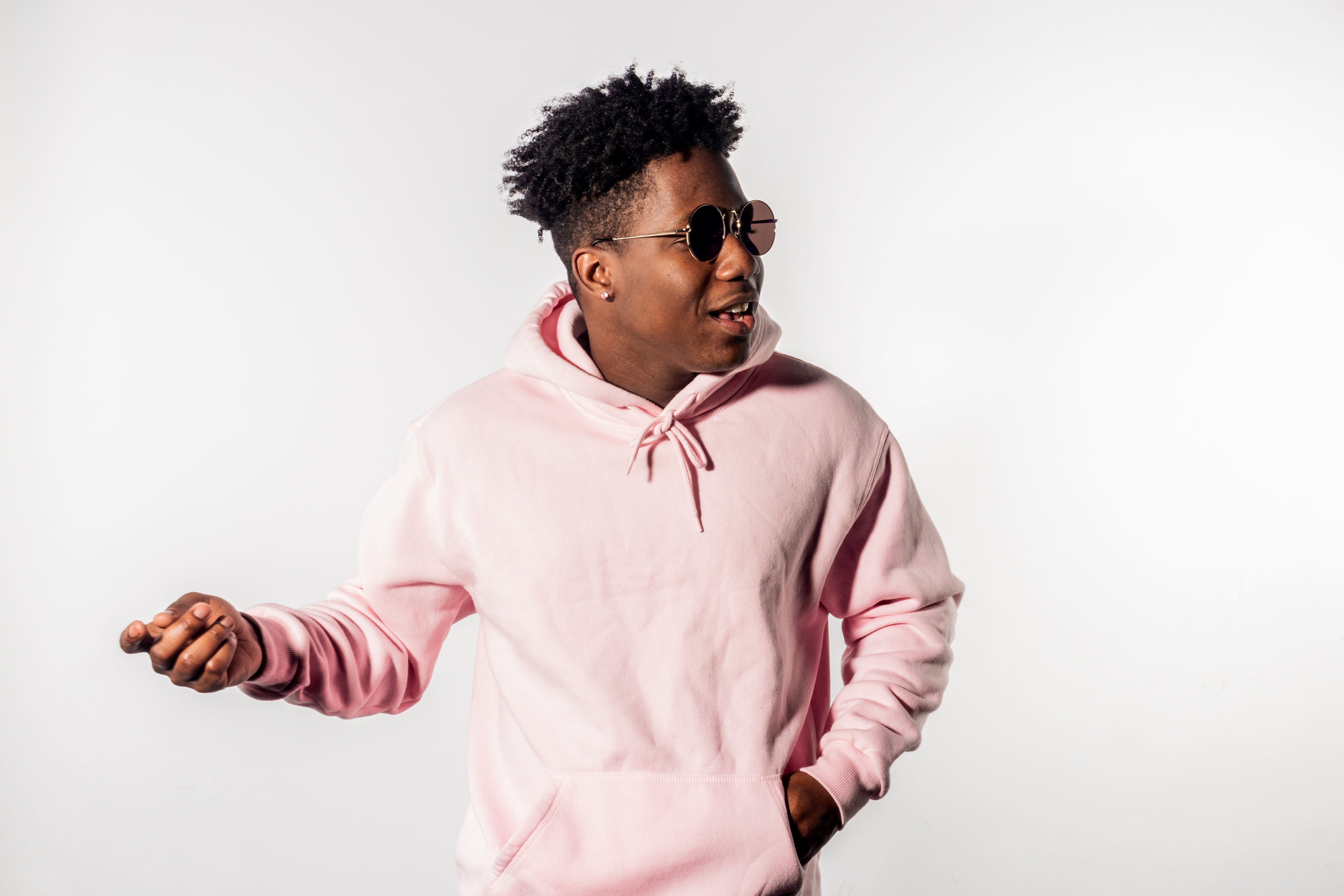 glasses, one person, afro, fashion, emotion, hairstyle, male, hoodie, men, looking, pink color, wearing, dancing, pose, man, isiah gibson, happy, 5K, highkey, HD Wallpaper