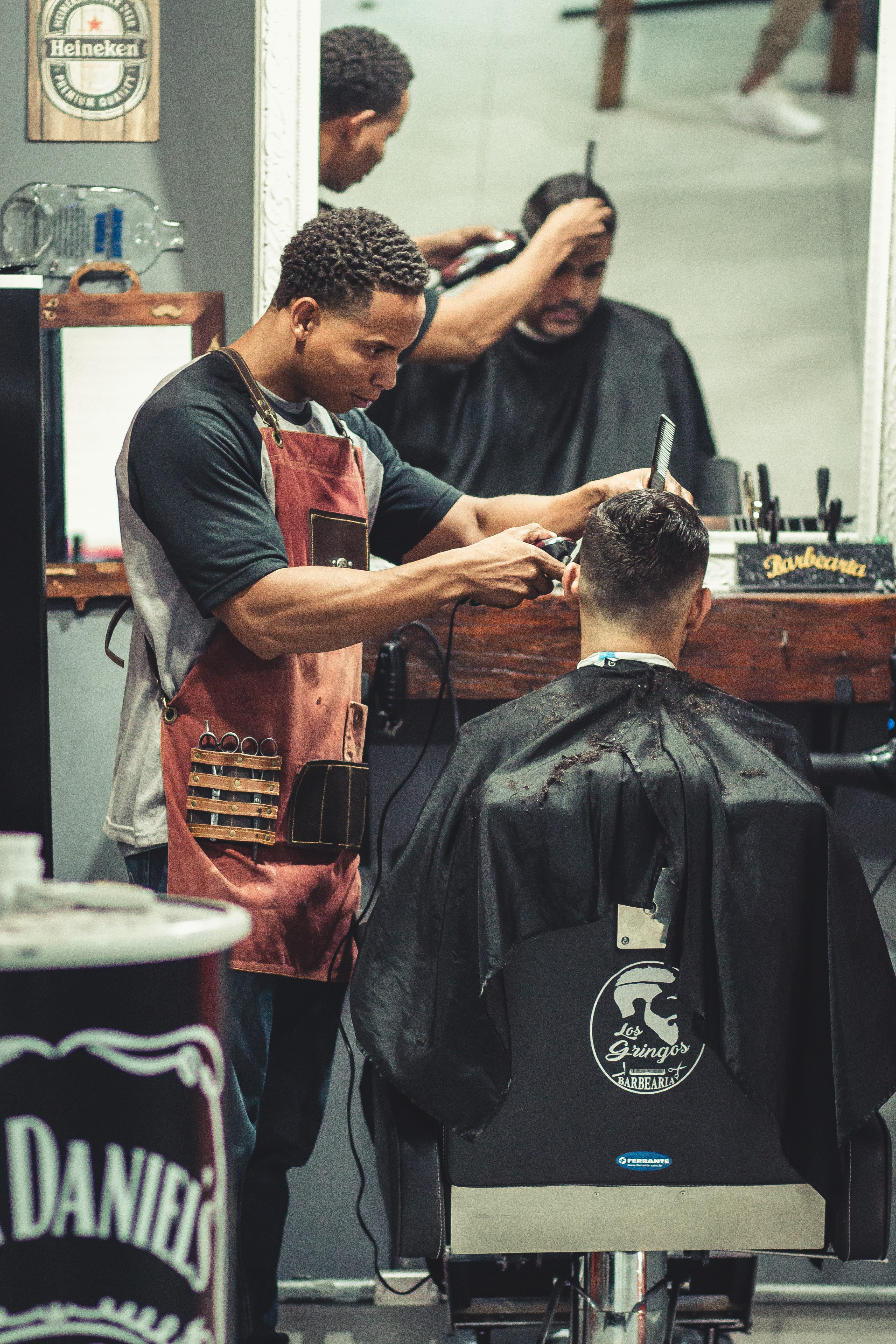 barber shop, young adult, facial expression, mirror, work, indoors, hairstyle, men, music, person, people, focus on foreground, standing, occupation, wear, Phone HD Wallpaper