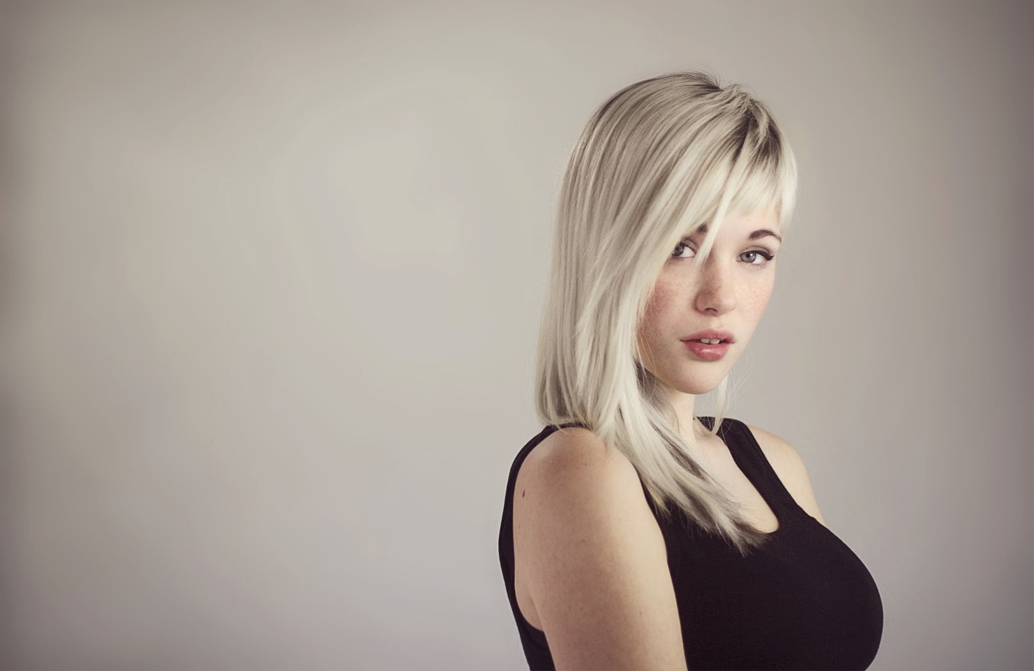 blonde, young adult, looking at camera, tank, one person, hairstyle, studio shot, beautiful people, black, indoors, portrait, fashion, face, blond hair, HD Wallpaper