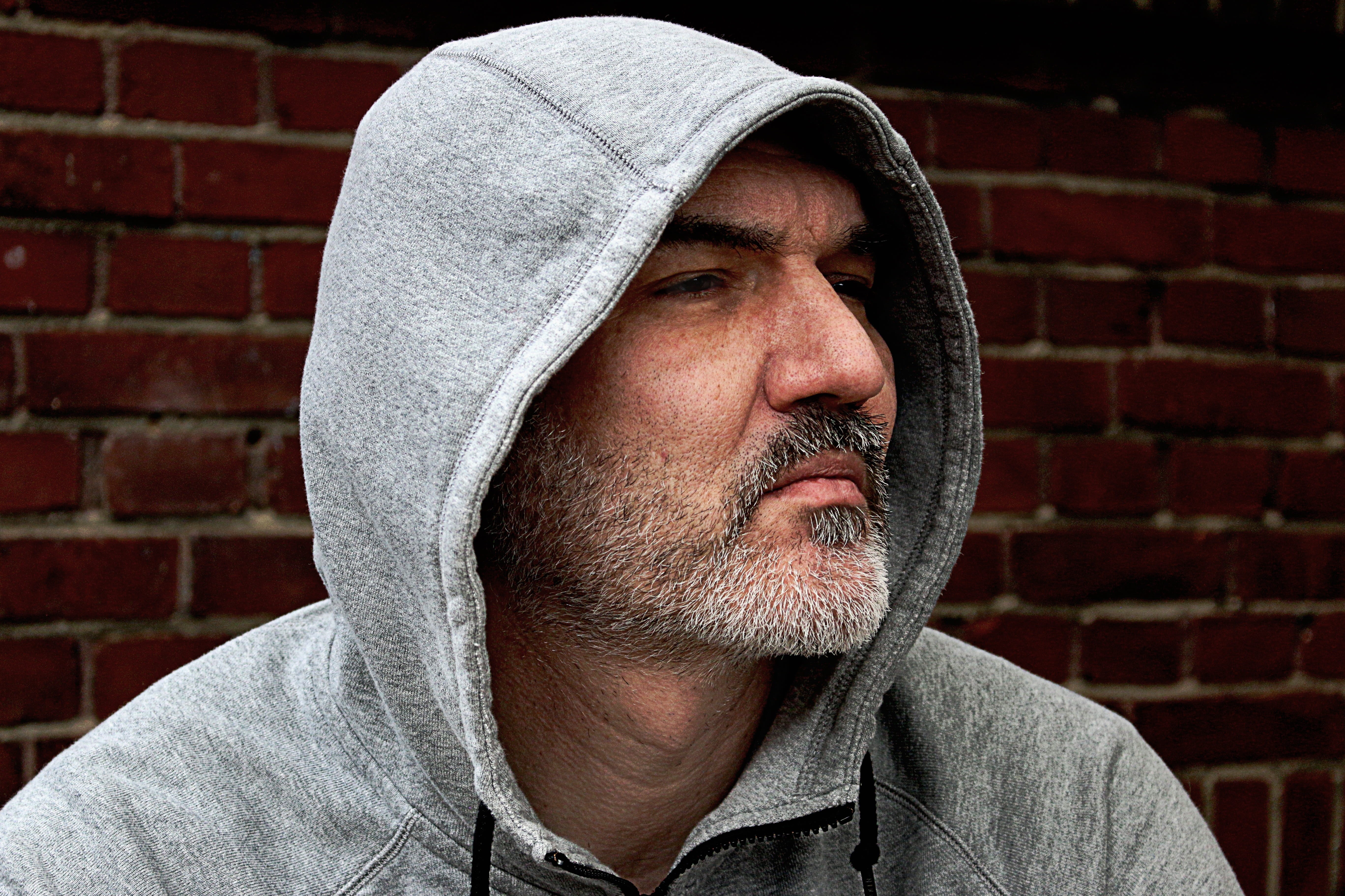 portrait, beard, serious, people, 5K, profile, color Image, hooded Shirt, wall, brick, hoodie, jacket, contemplation, headshot, looking in, lifestyles, HD Wallpaper