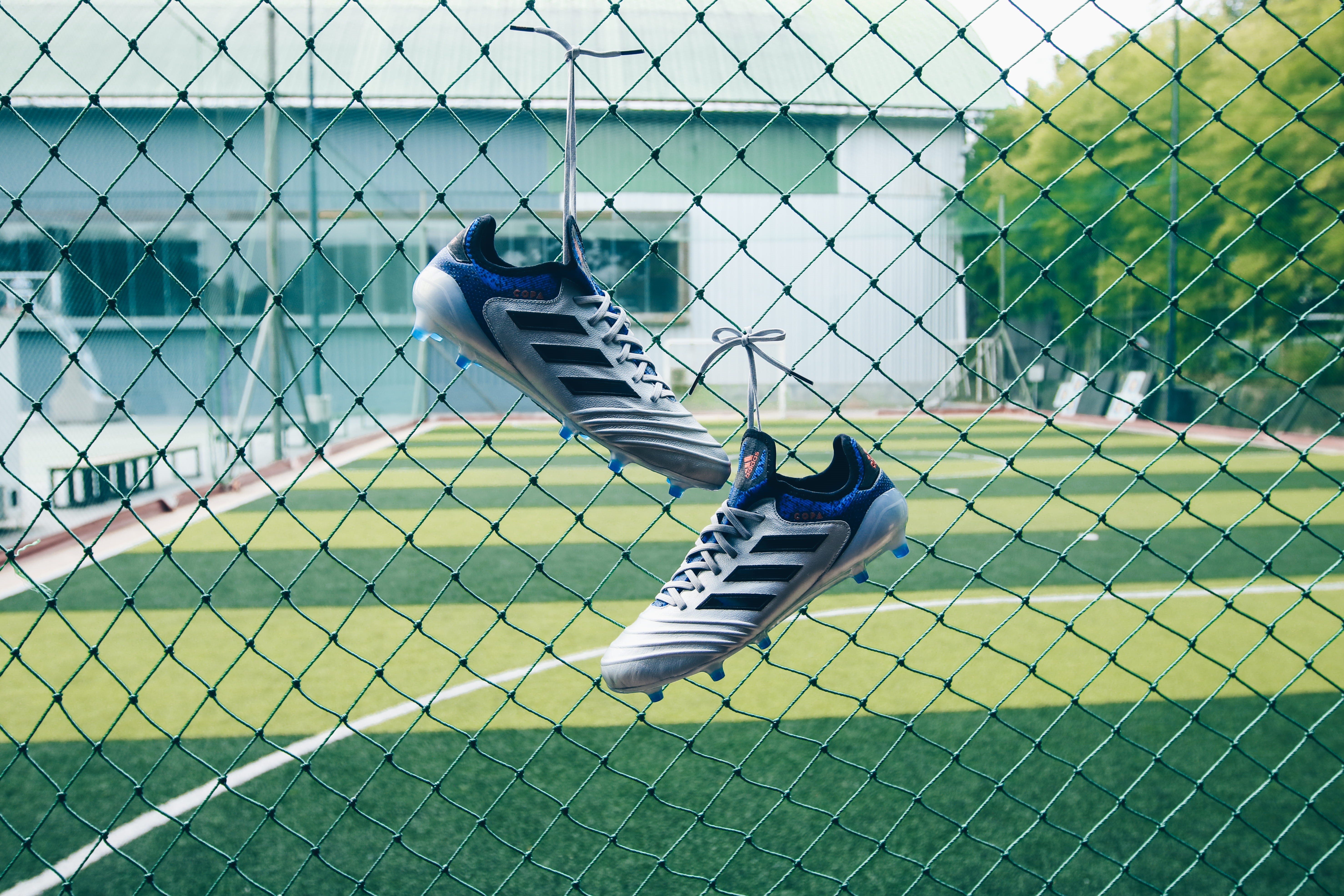 green, footwear, jakarta, security, adidas, barrier, pair, soccer, full length, outdoors, cleats, real people, cyclone, football, motion, 5K, sneaker, HD Wallpaper