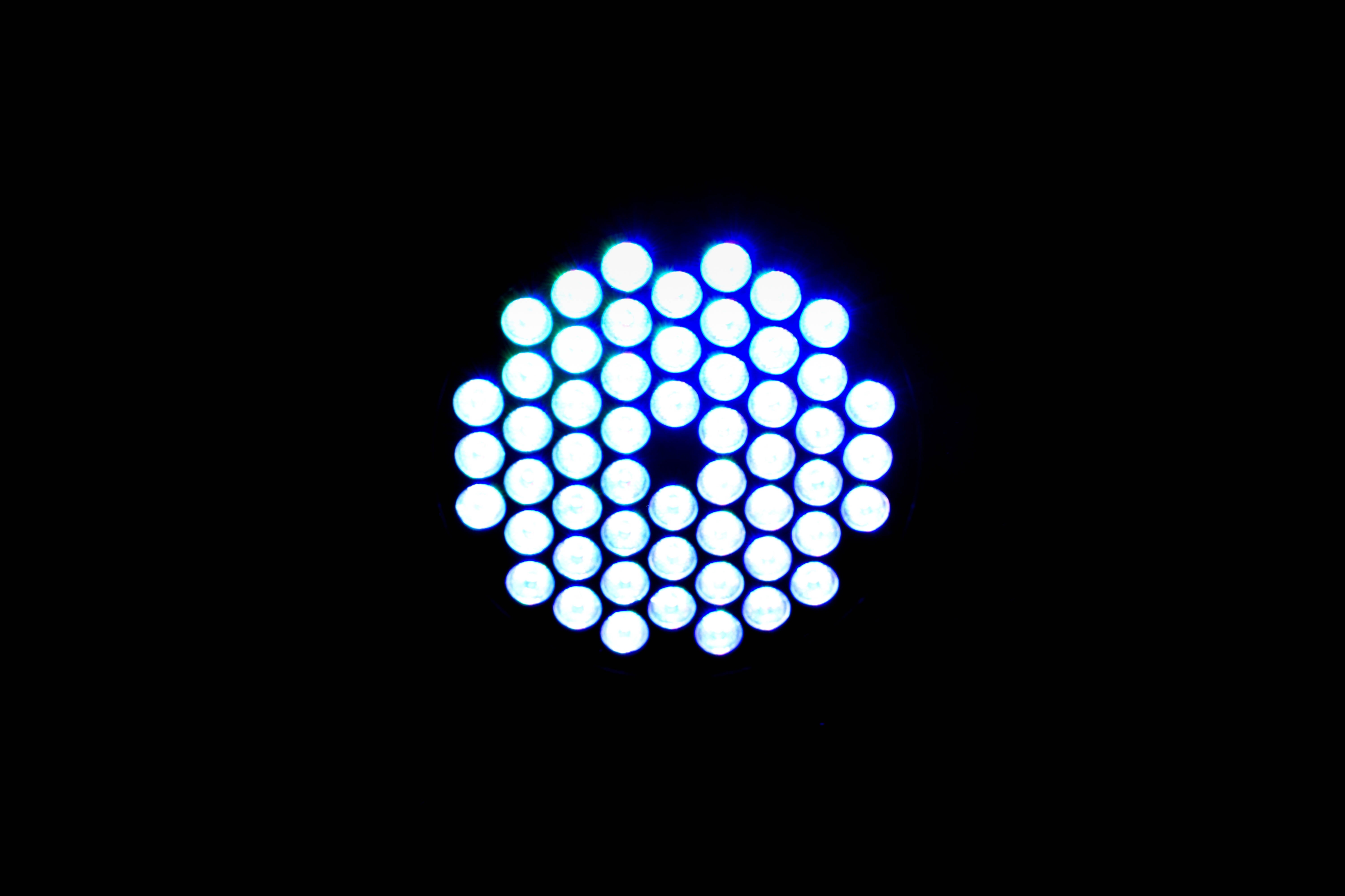 spotted, black background, 5K, blue, light bulb, indoors, geometric shape, symmetry, copy space, glowing, single object, close-up, illuminated, technology, HD Wallpaper