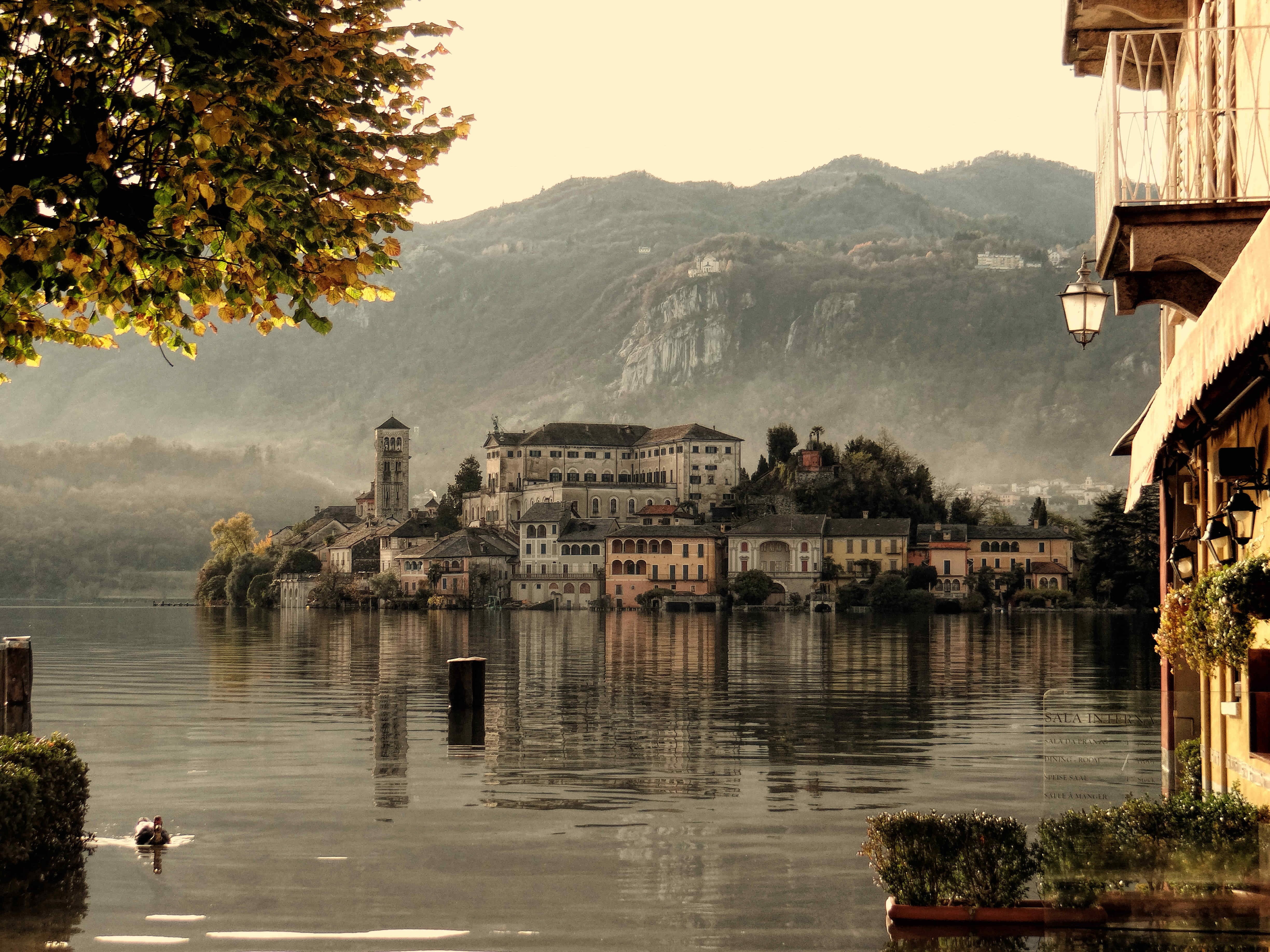 day, waterfront, outdoors, building exterior, lake, plant, mountain, panoramas, travel destinations, architecture, Lago Dorta, nature, city, built structure, HD Wallpaper