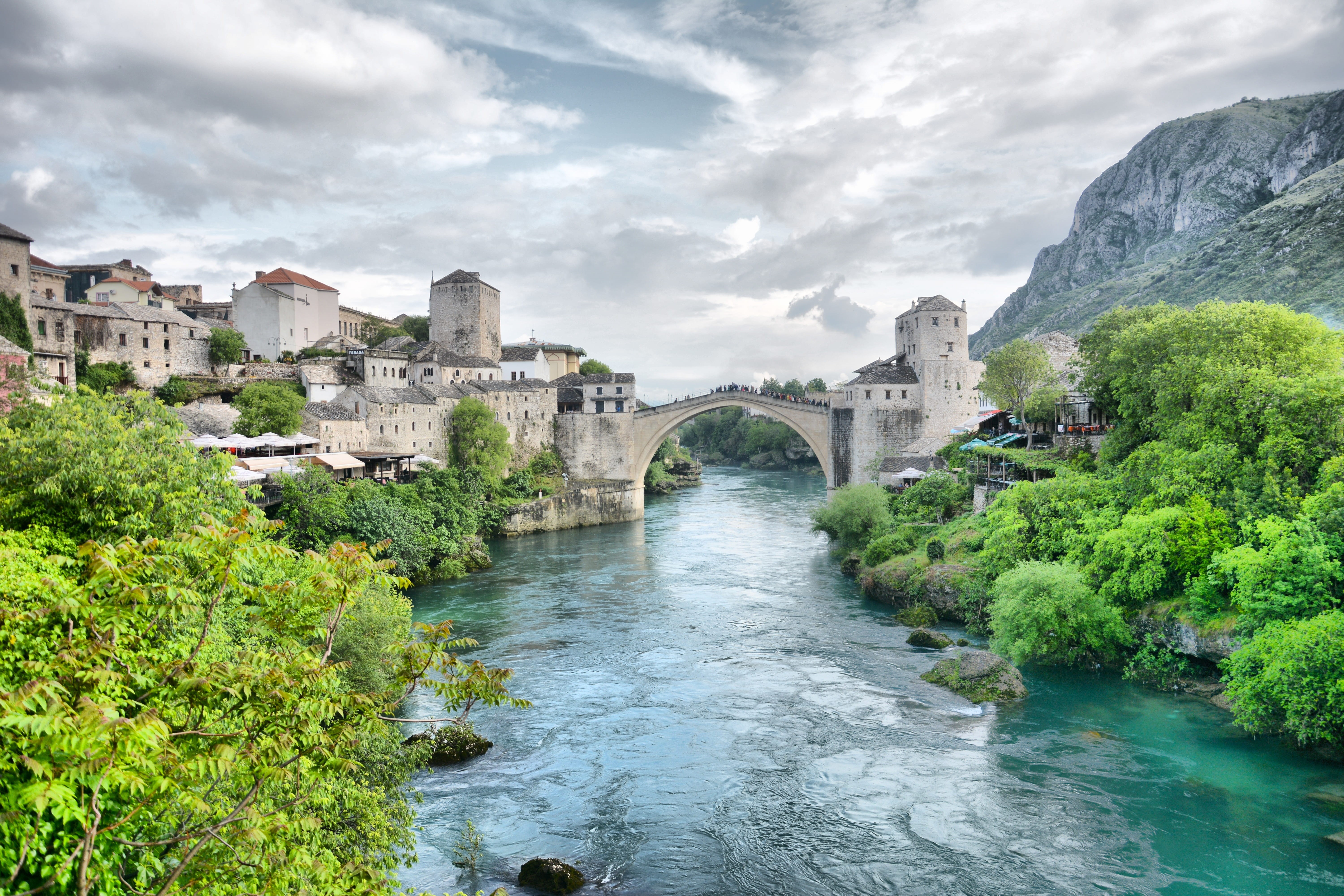 tree, travel Destinations, old bridge, travel, ottoman, cloud - sky, hdr, water, 5K, architecture, blue, mostar, sky, body, scenics, attraction, bridge, HD Wallpaper