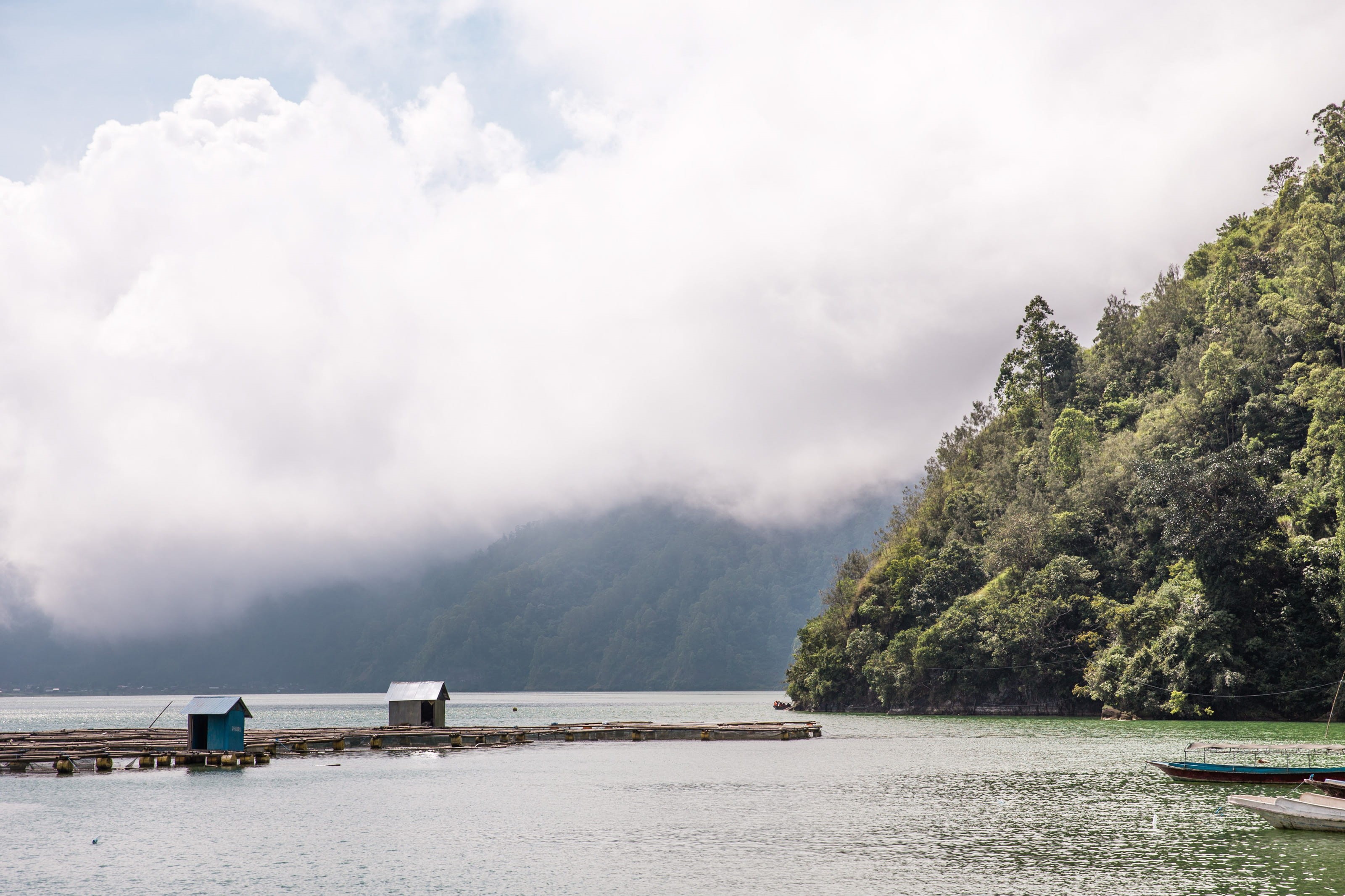 cloud covering moutains, hut, shimmering, water, 2K, no people, cloud - sky, tree, foliage, tranquility, bay, overcast day, transportation, seaside, sea, HD Wallpaper