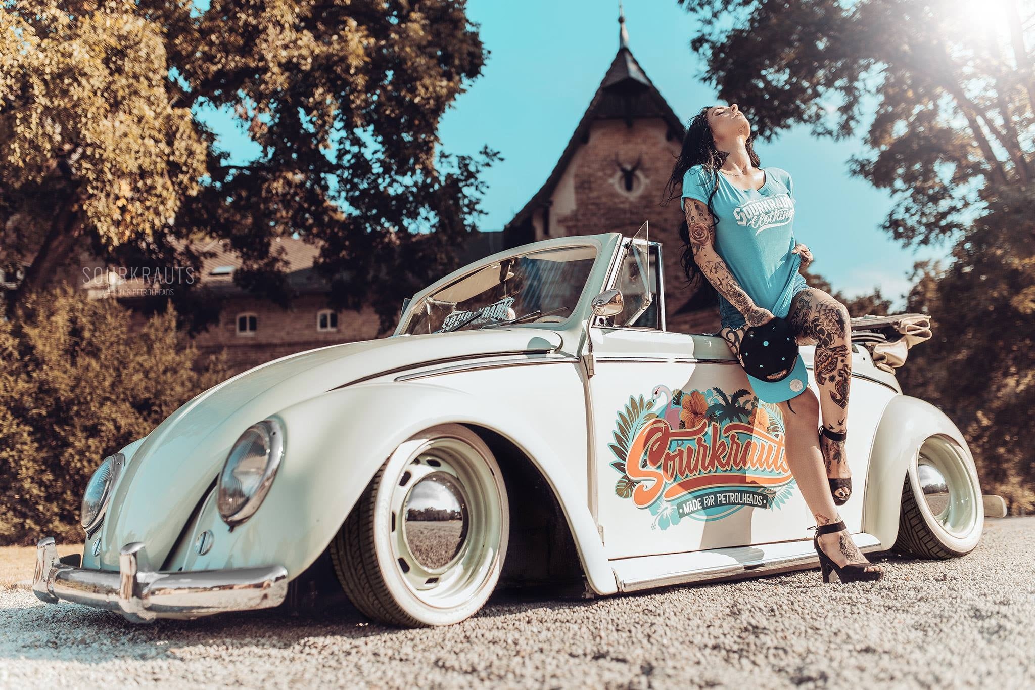 convertible, stationary, day, 1080P, pose, plant, vintage car, girl, motor vehicle, leisure activity, road, teal, retro styled, transportation, mode of transportation, HD Wallpaper