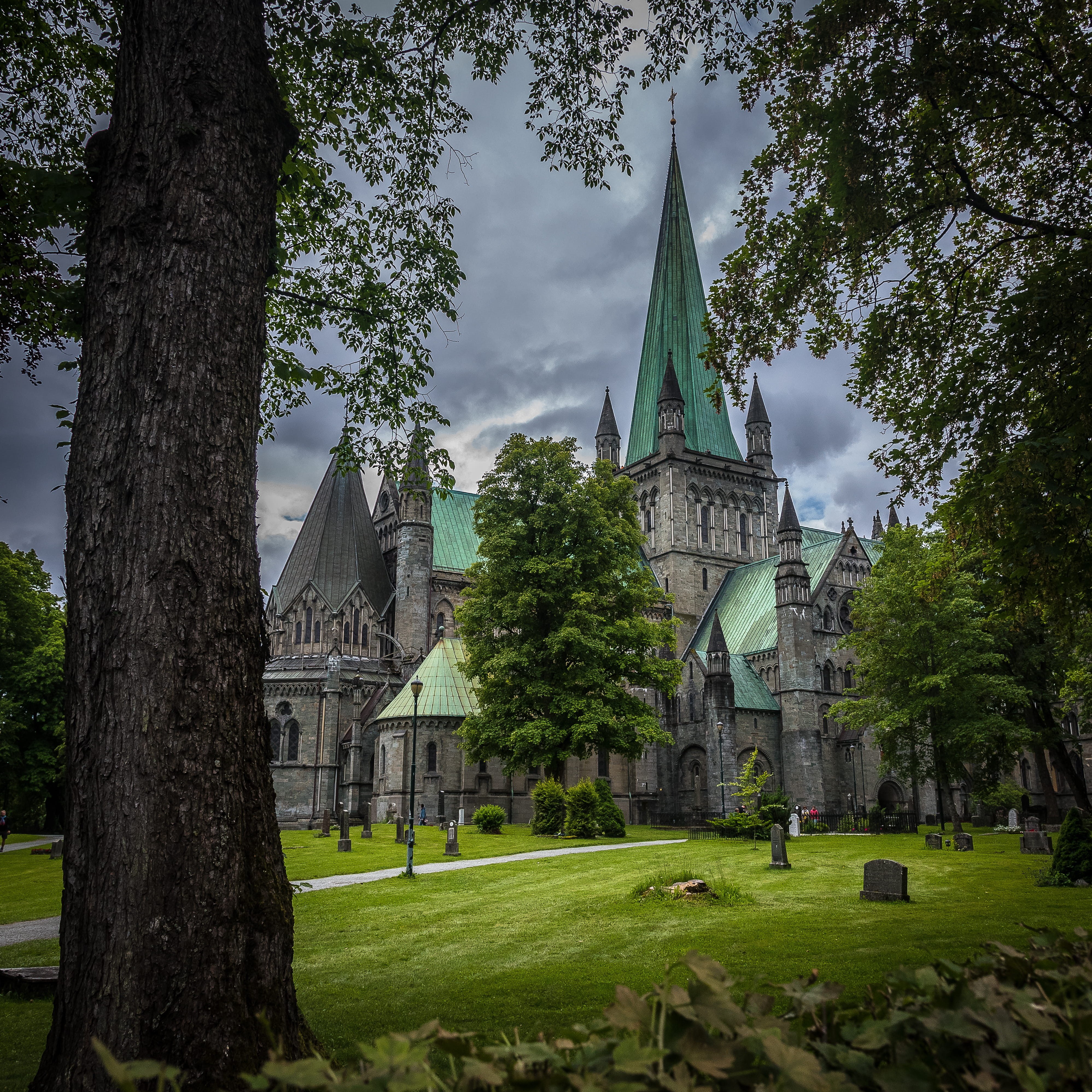 church, built structure, outdoors, intimidating, grass, 4K, norway, green color, framing, tree, lawn, spire, plant, nature, day, cloudy, belief, building, Phone HD Wallpaper