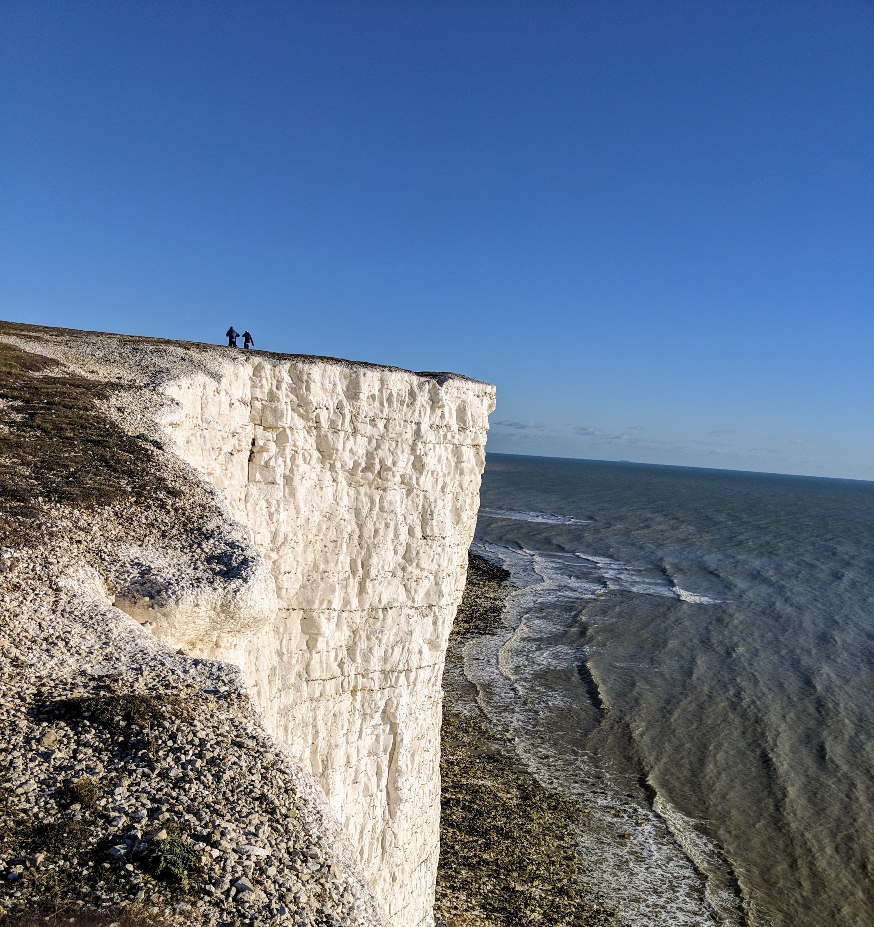scenery, beauty in nature, human, promontory, outdoors, vulture, mountain, horizon over water, land, sky, ice, water, nature, sea, s downs way, day, plateau, Phone HD Wallpaper